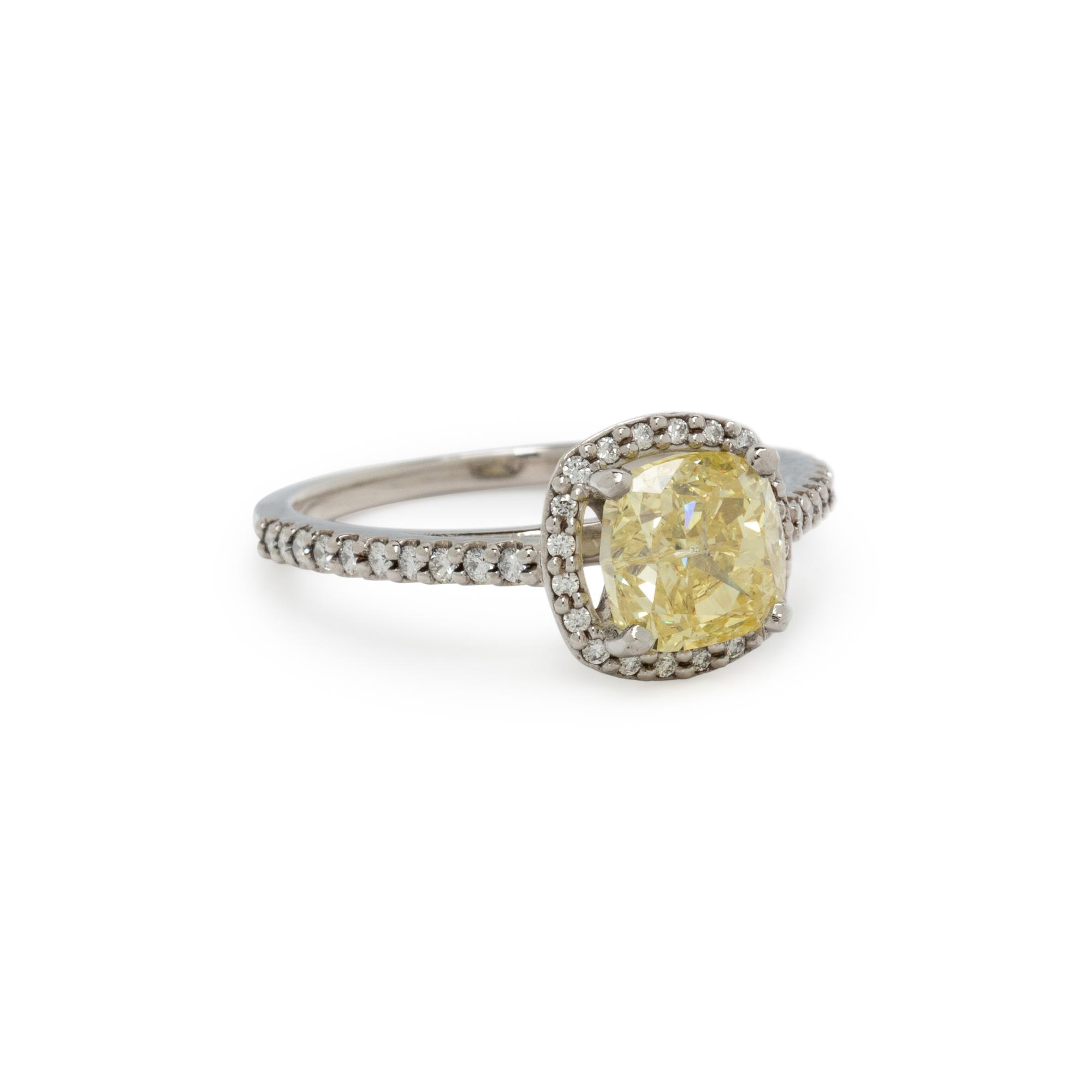 FANCY INTENSE YELLOW DIAMOND AND DIAMOND RING