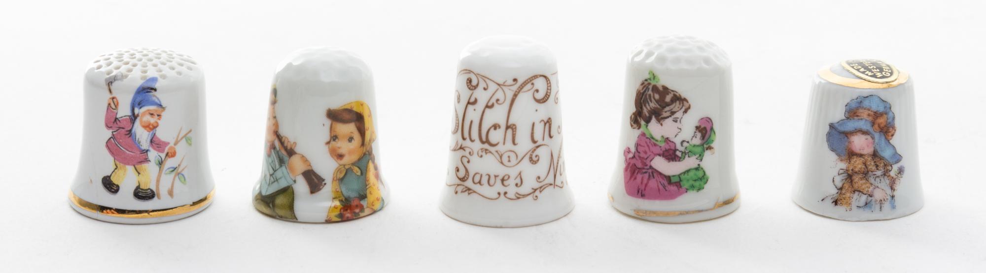 A Group of Porcelain Thimbles Height of first 7/8 inch.