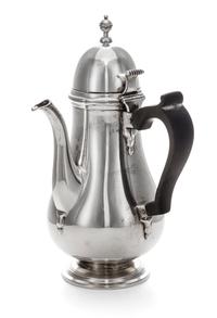 An American Silver Chocolate Pot, Tuttle Silversmiths, Boston, MA, of baluster form with a wood handle and a circular foot.