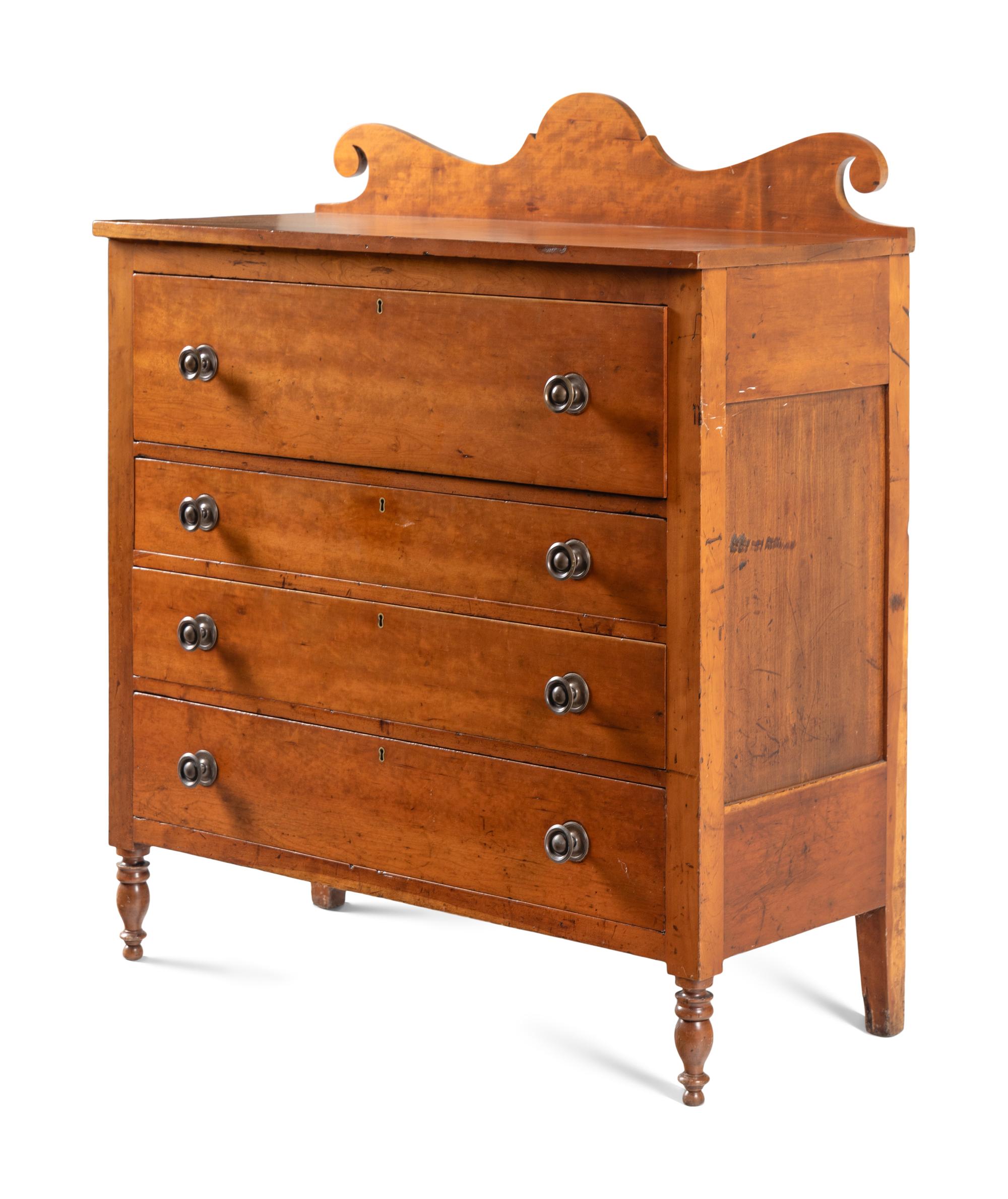 A Late Classical Carved Cherrywood Chest of Drawers