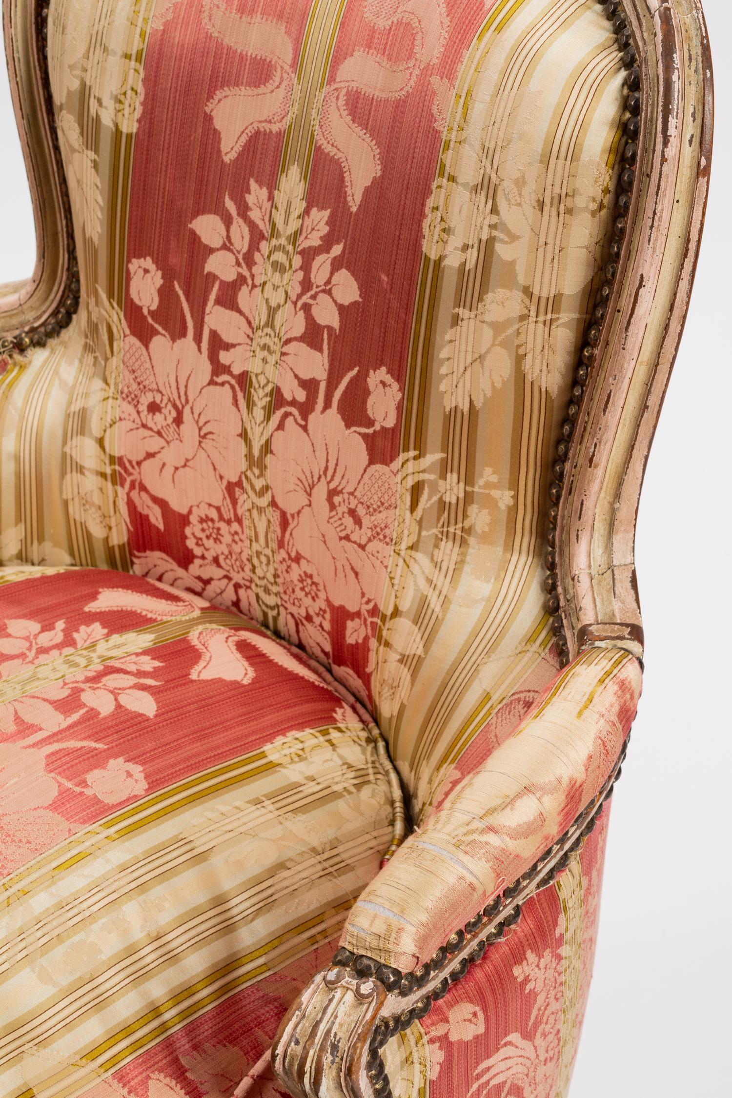 A Pair of Louis XV Silk-Upholstered and Painted Bergeres