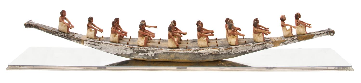 An Egyptian Gesso Painted Model of a Funerary Boat, Width 49 1/2 inches.
