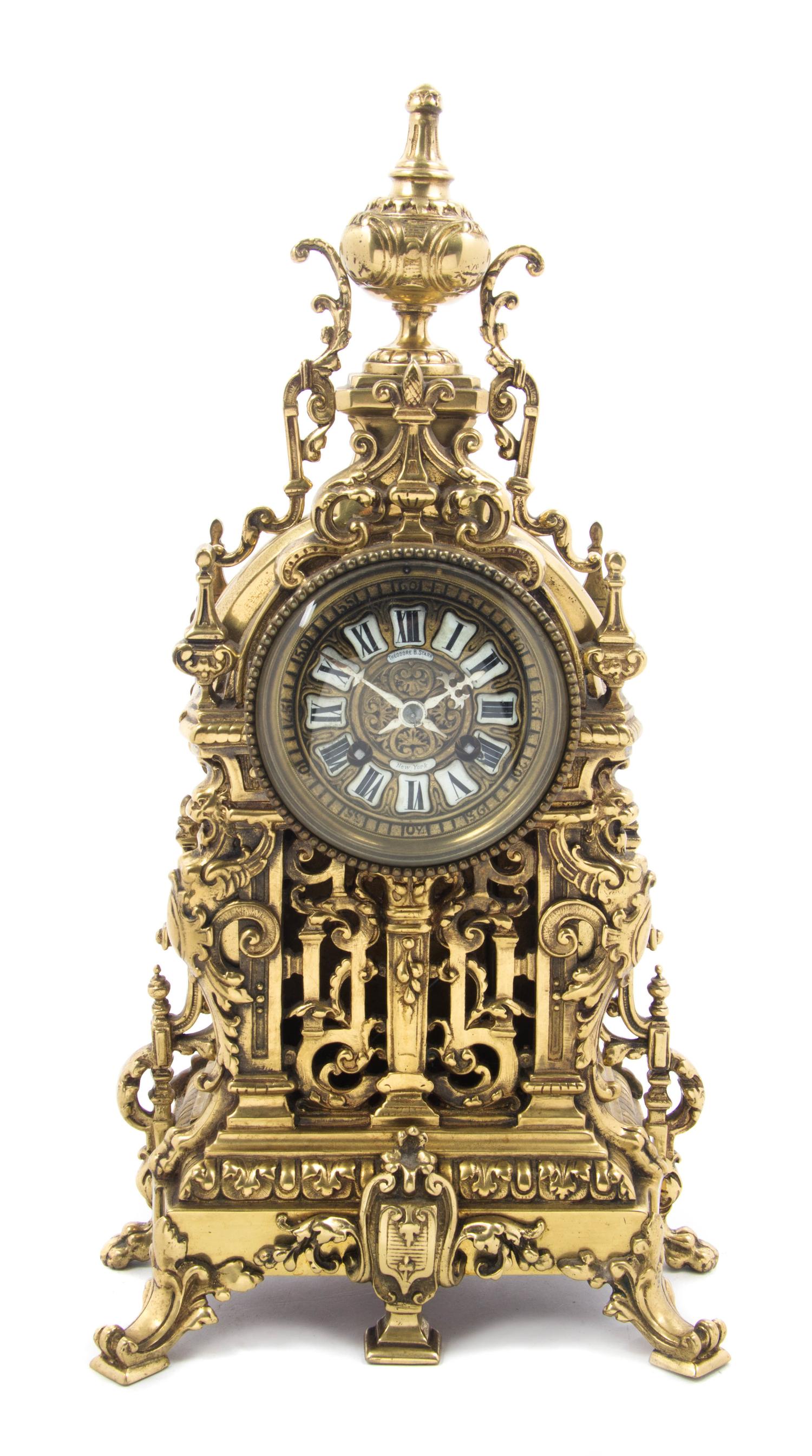 A French Gilt Bronze Mantel Clock, RETAILED BY THEODORE B. STARR, NEW YORK, MOVEMENT BY JAPY FRERES, Height 17 1/4 inches. — RETAILED BY THEODORE B. STARR, NEW YORK, MOVEMENT BY JAPY FRERES,