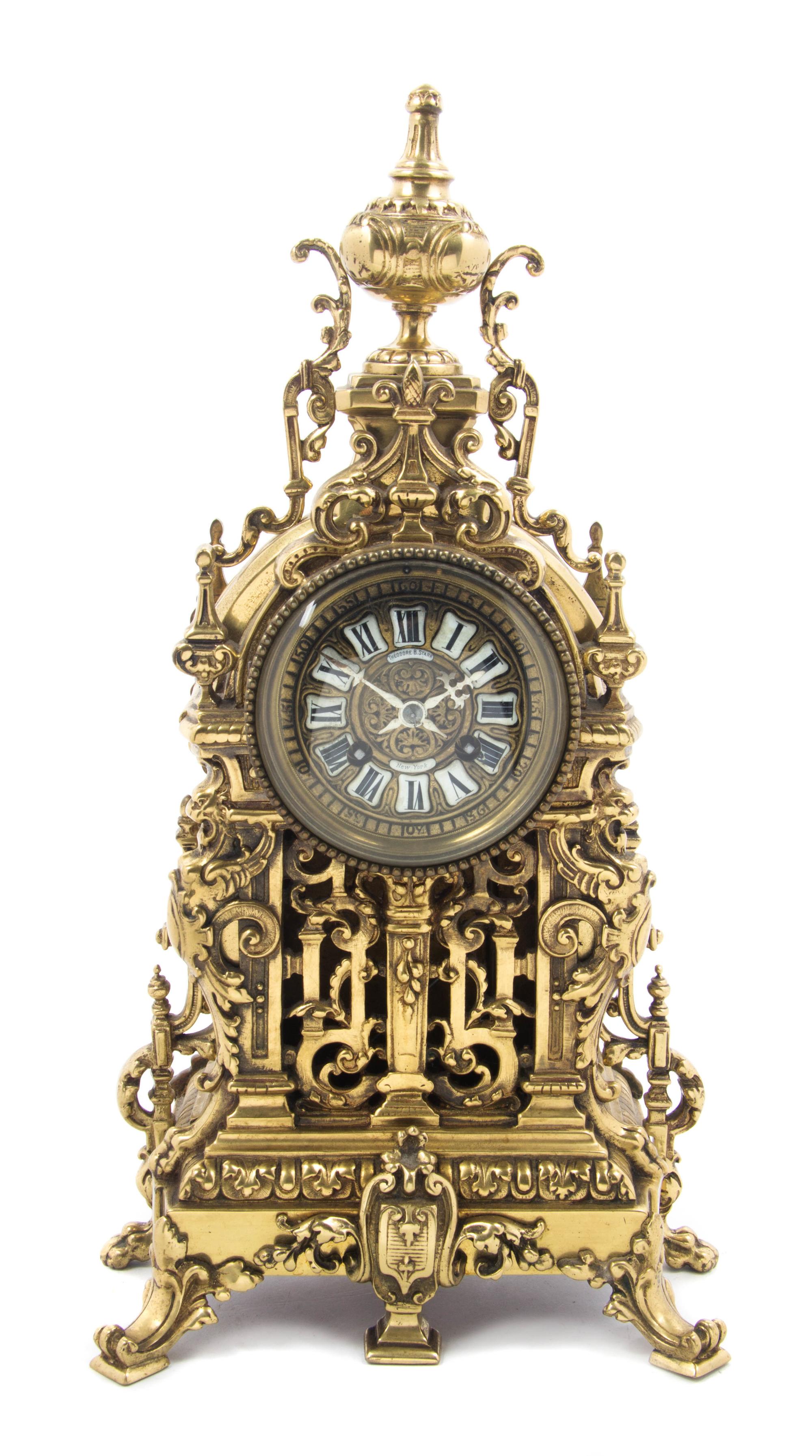 A French Gilt Bronze Mantel Clock, RETAILED BY THEODORE B. STARR, NEW YORK, MOVEMENT BY JAPY FRERES, Height 17 1/4 inches. — RETAILED BY THEODORE B. STARR, NEW YORK, MOVEMENT BY JAPY FRERES,