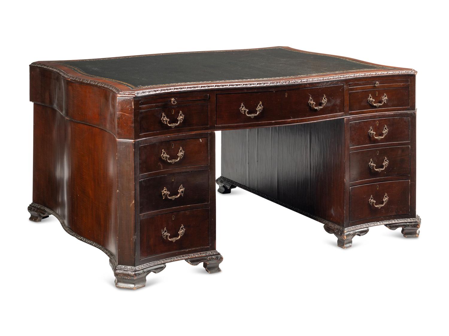 A George III Carved Mahogany Partners Desk