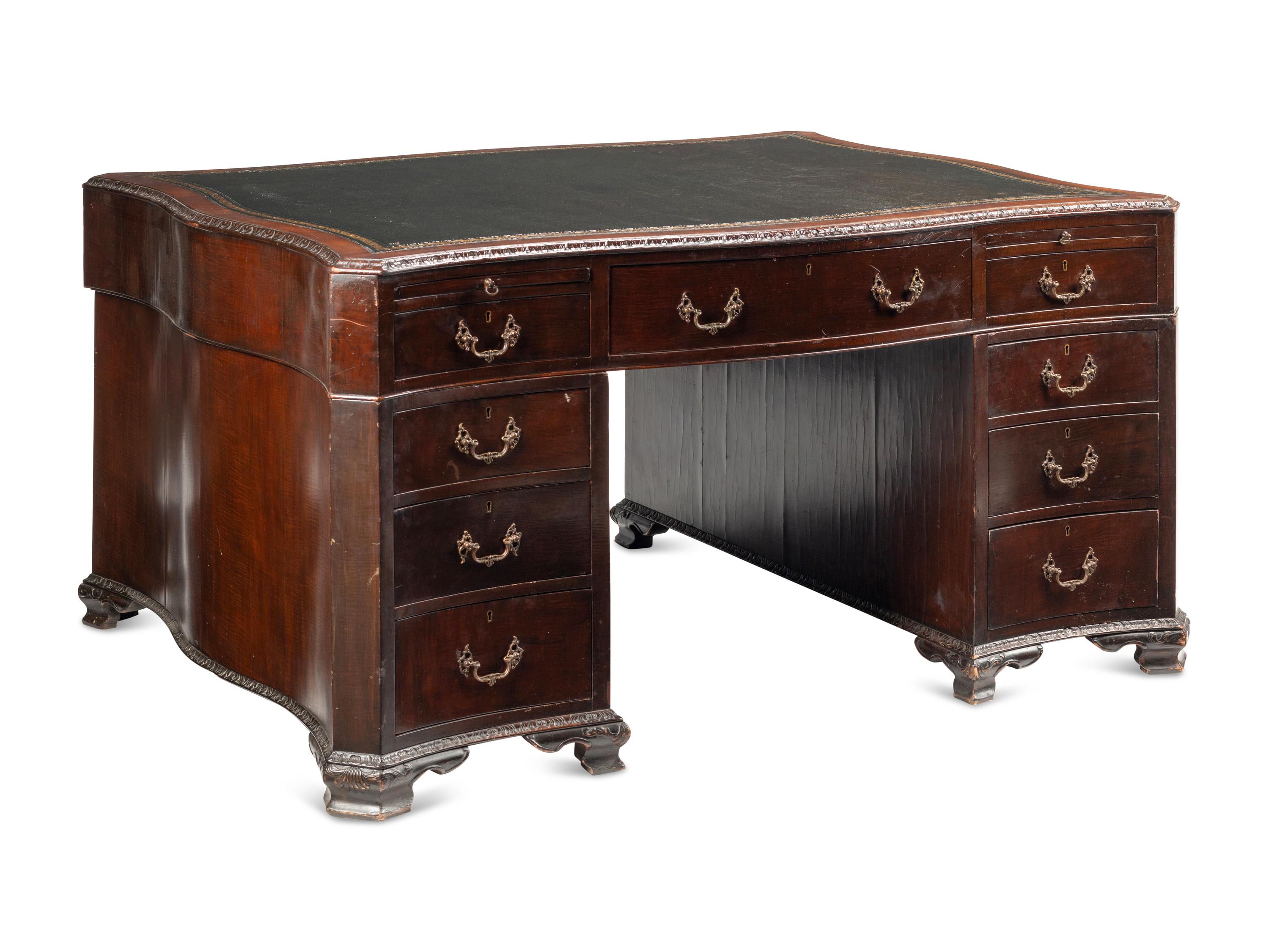 A George III Carved Mahogany Partners Desk