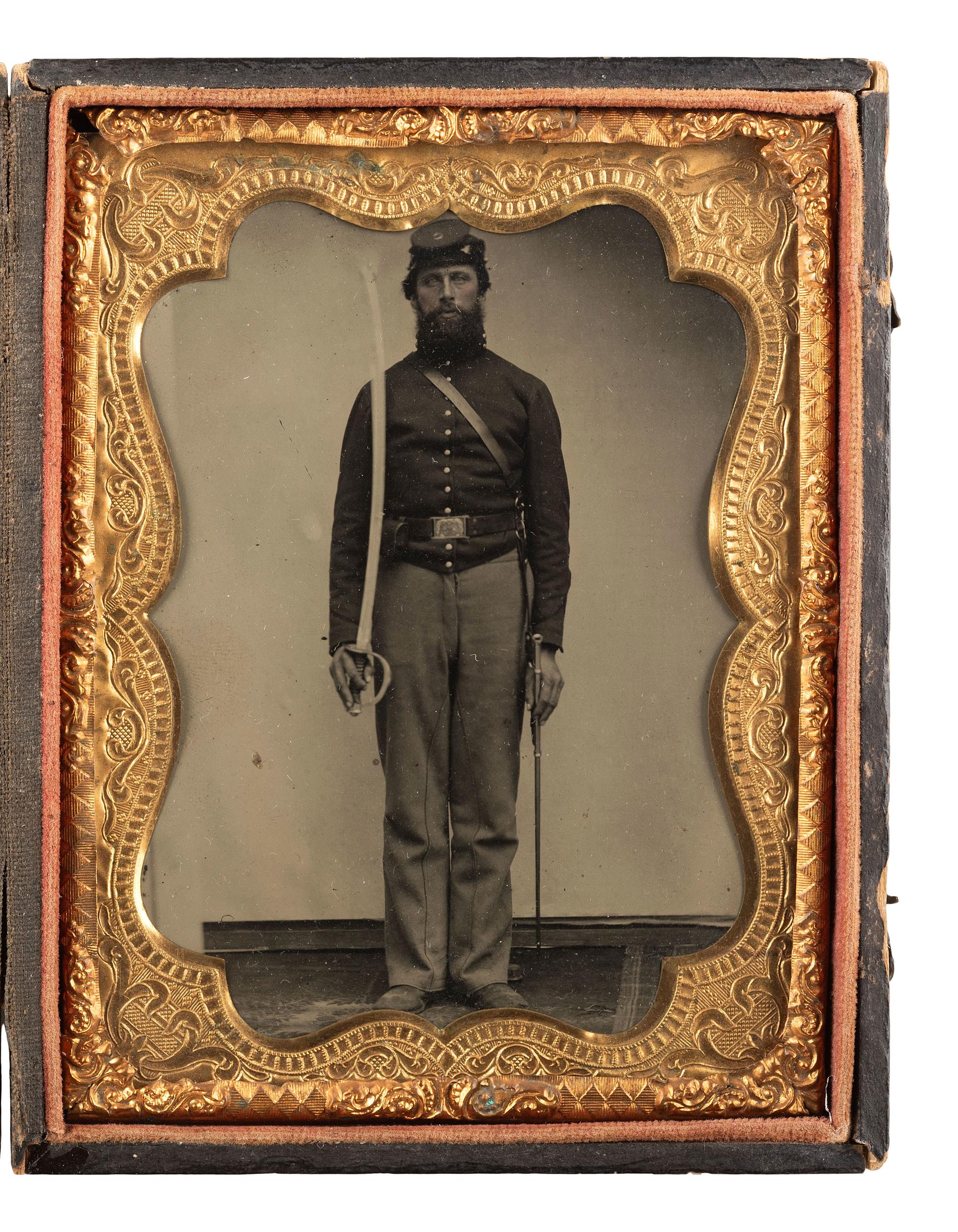 [CIVIL WAR]. Quarter plate tintype of a Union cavalry soldier displaying his saber.