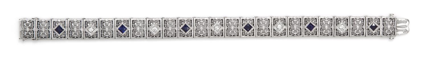 A Platinum, 14 Karat White Gold, Diamond and Synthetic Sapphire Bracelet, 10.50 dwts.