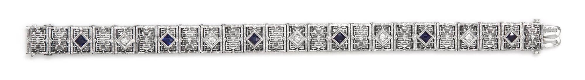 A Platinum, 14 Karat White Gold, Diamond and Synthetic Sapphire Bracelet, 10.50 dwts.