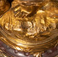 A French Gilt Bronze and Marble Figural Clock