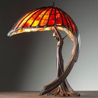 A Cast Bronze and Glass Figural Table Lamp