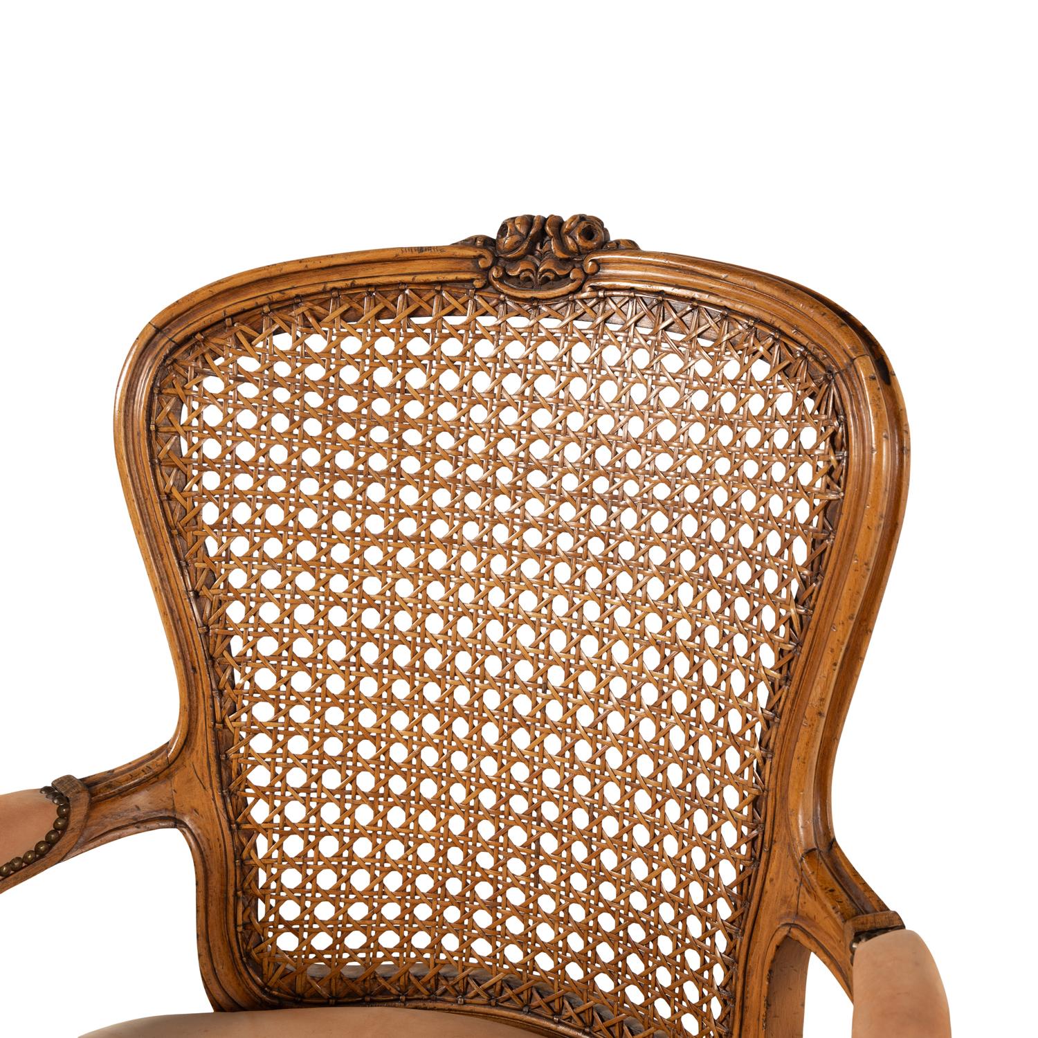 A Pair of Louis XV Style Nubuck Upholstered and Caned Fauteuils