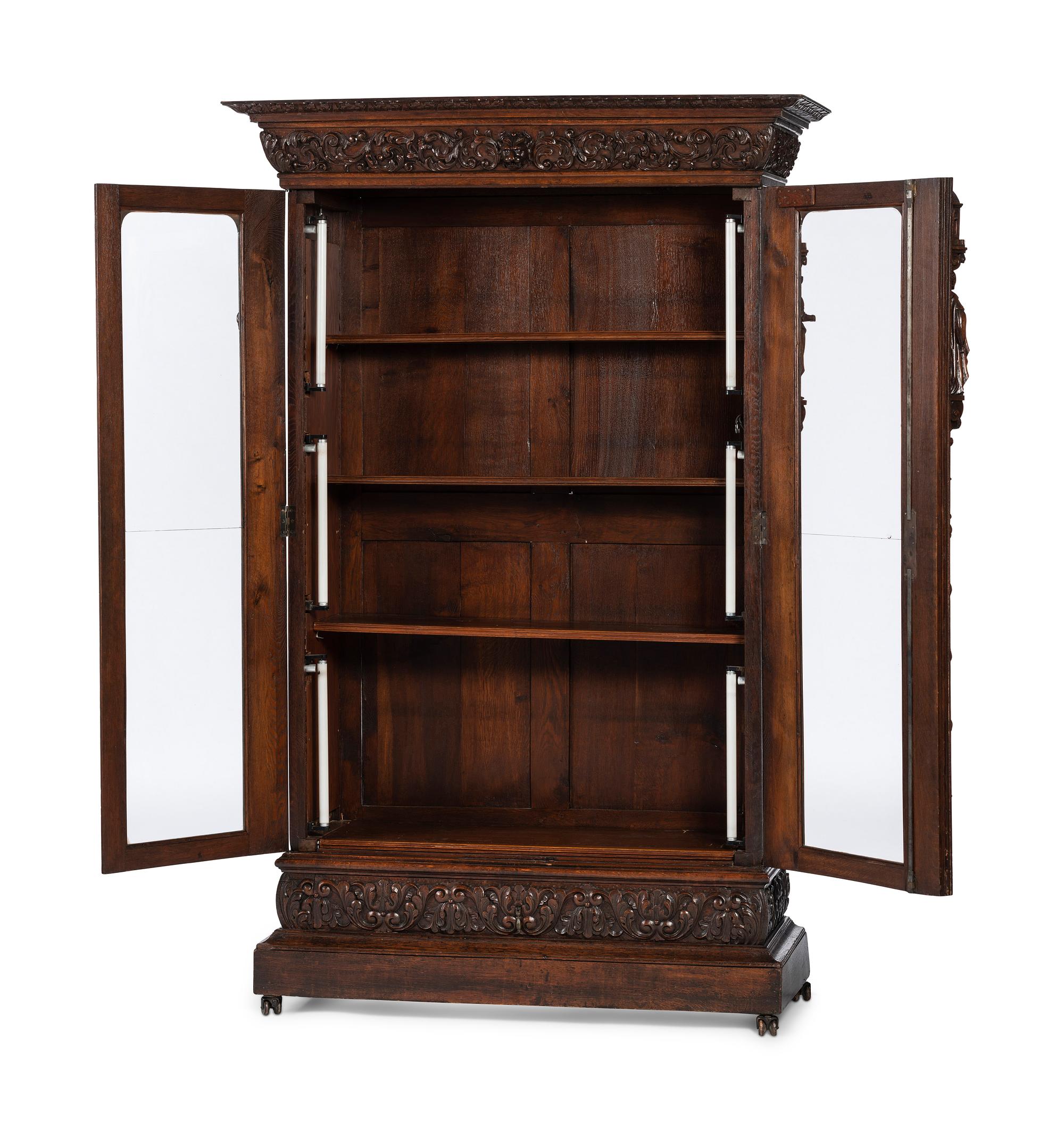 A Renaissance Revival Carved Oak Display Cabinet
