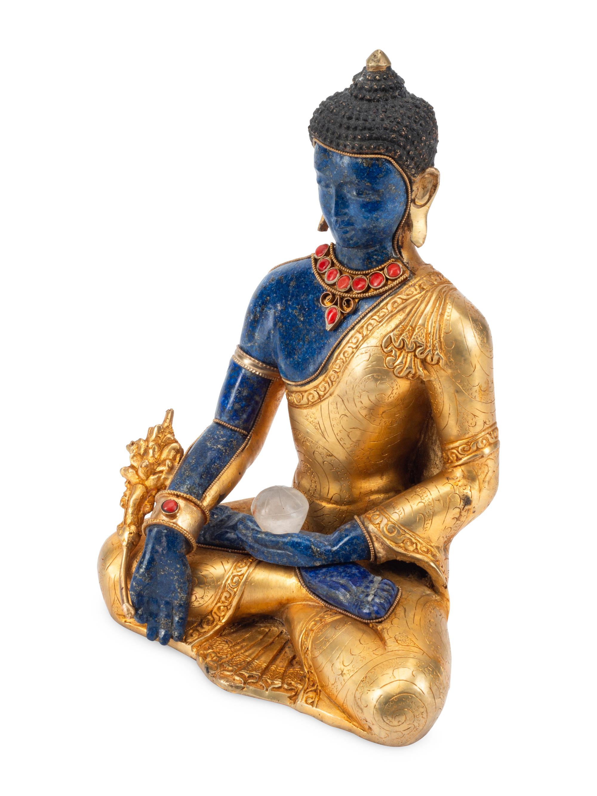 A Tibetan Style Gilt Bronze and Lapis Lazuli Seated Deity