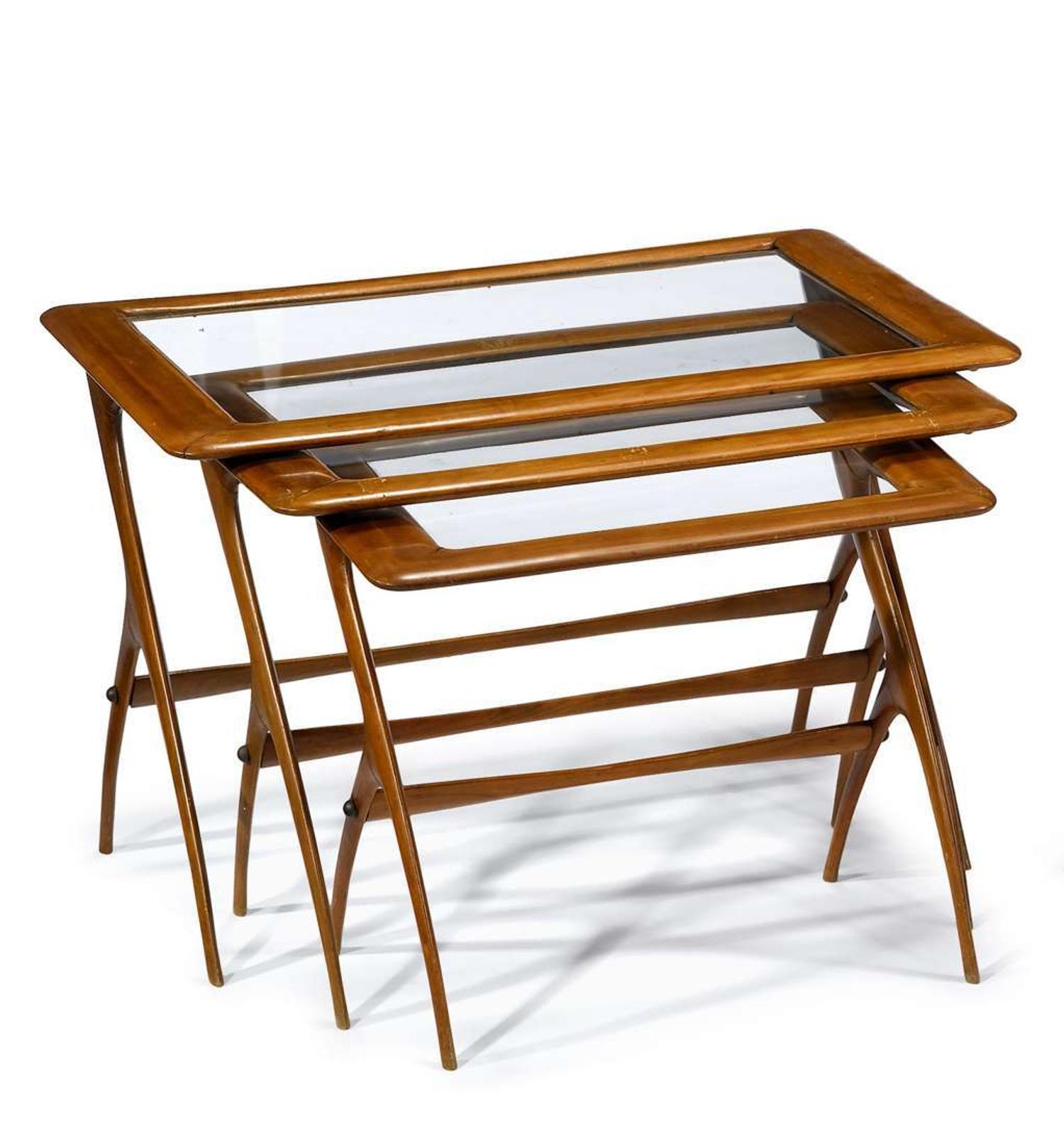 Nest of three maple and glass tables 20th century