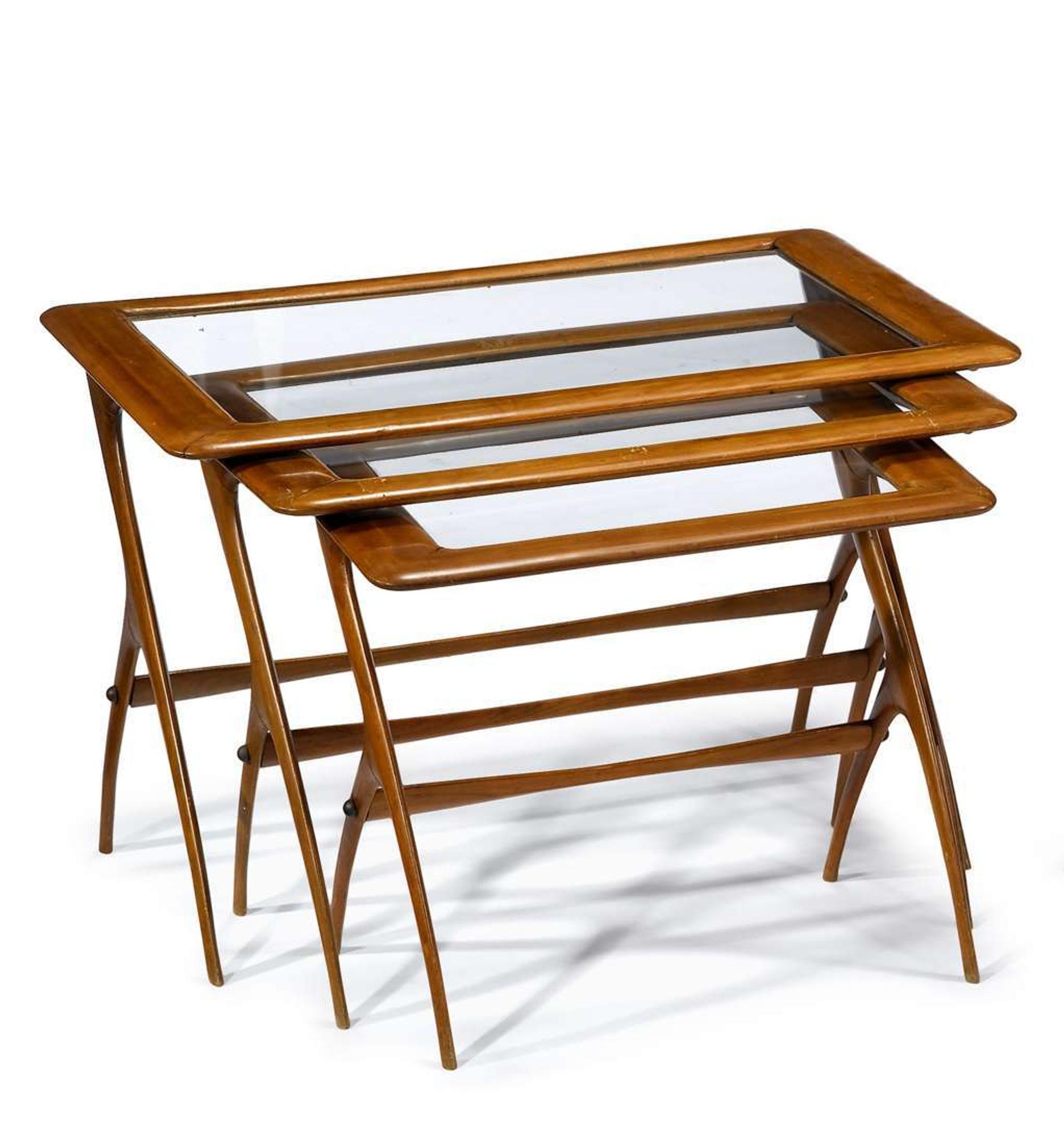 Nest of three maple and glass tables 20th century