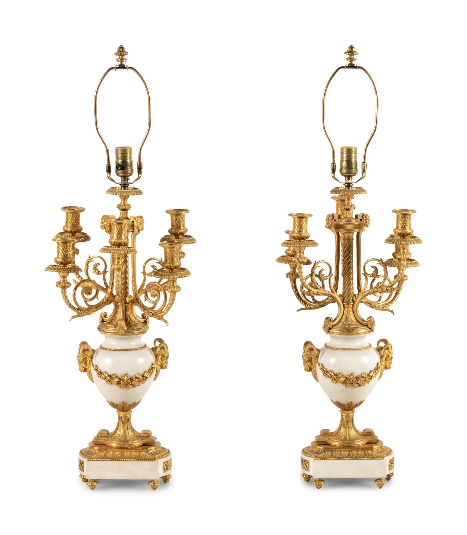 A Pair of Louis XVI Style Gilt Bronze and White Marble Six-Light Candelabra