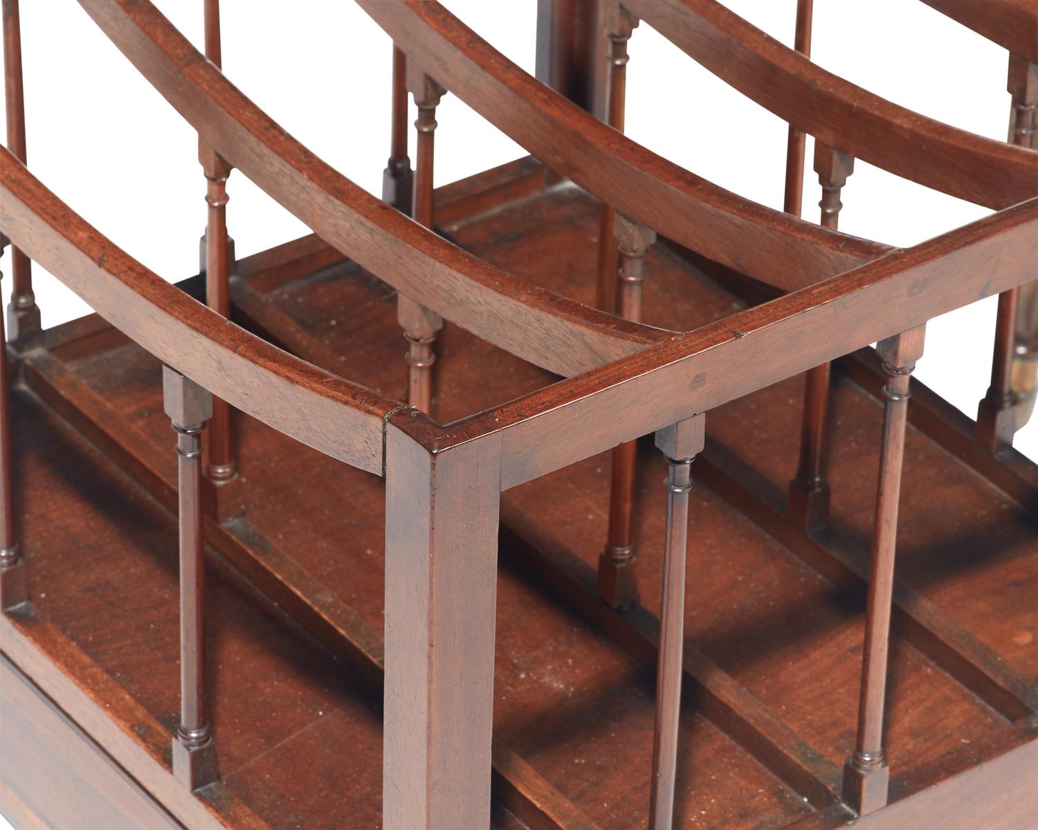 Two Regency style mahogany canterburies and a mahogany bookstand, 19th / 20th century