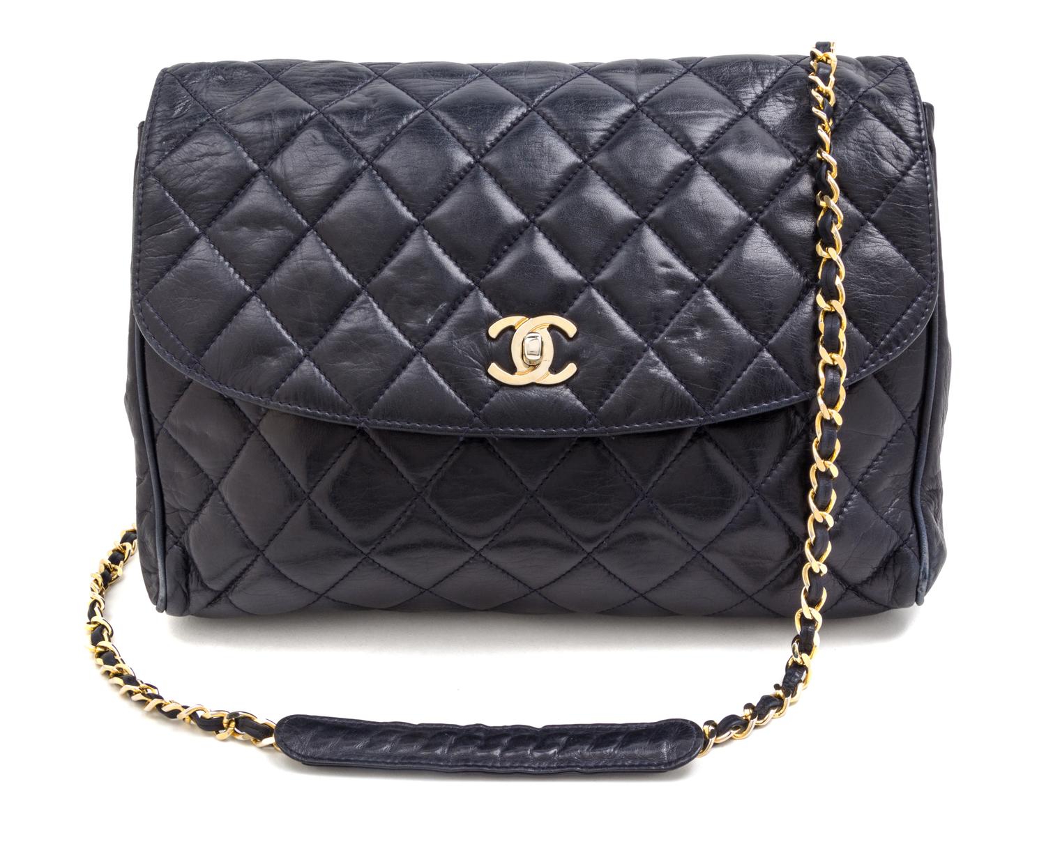 A Chanel Navy Quilted Leather Flap Handbag, 11" x 10" x 3".