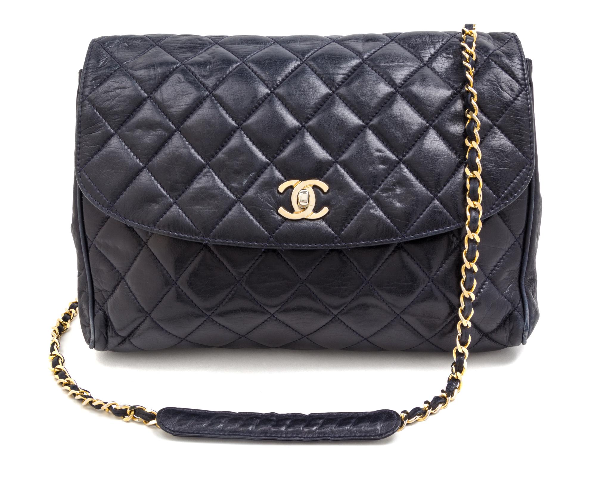 A Chanel Navy Quilted Leather Flap Handbag, 11" x 10" x 3".