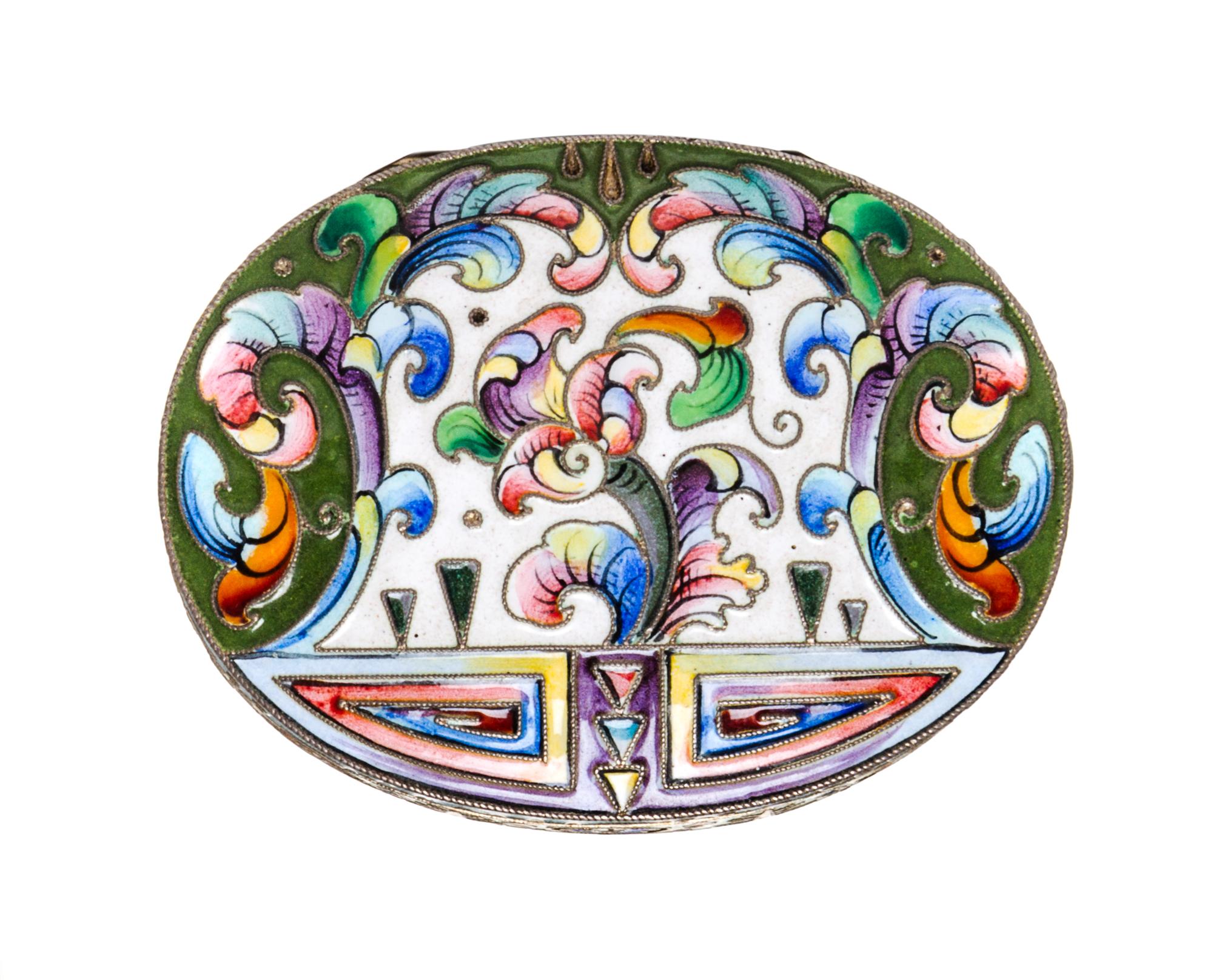 A Russian Enameled Silver Pill Box, 6th Artel, Moscow, 1908-1926, of oval form with floral and geometric decoration.