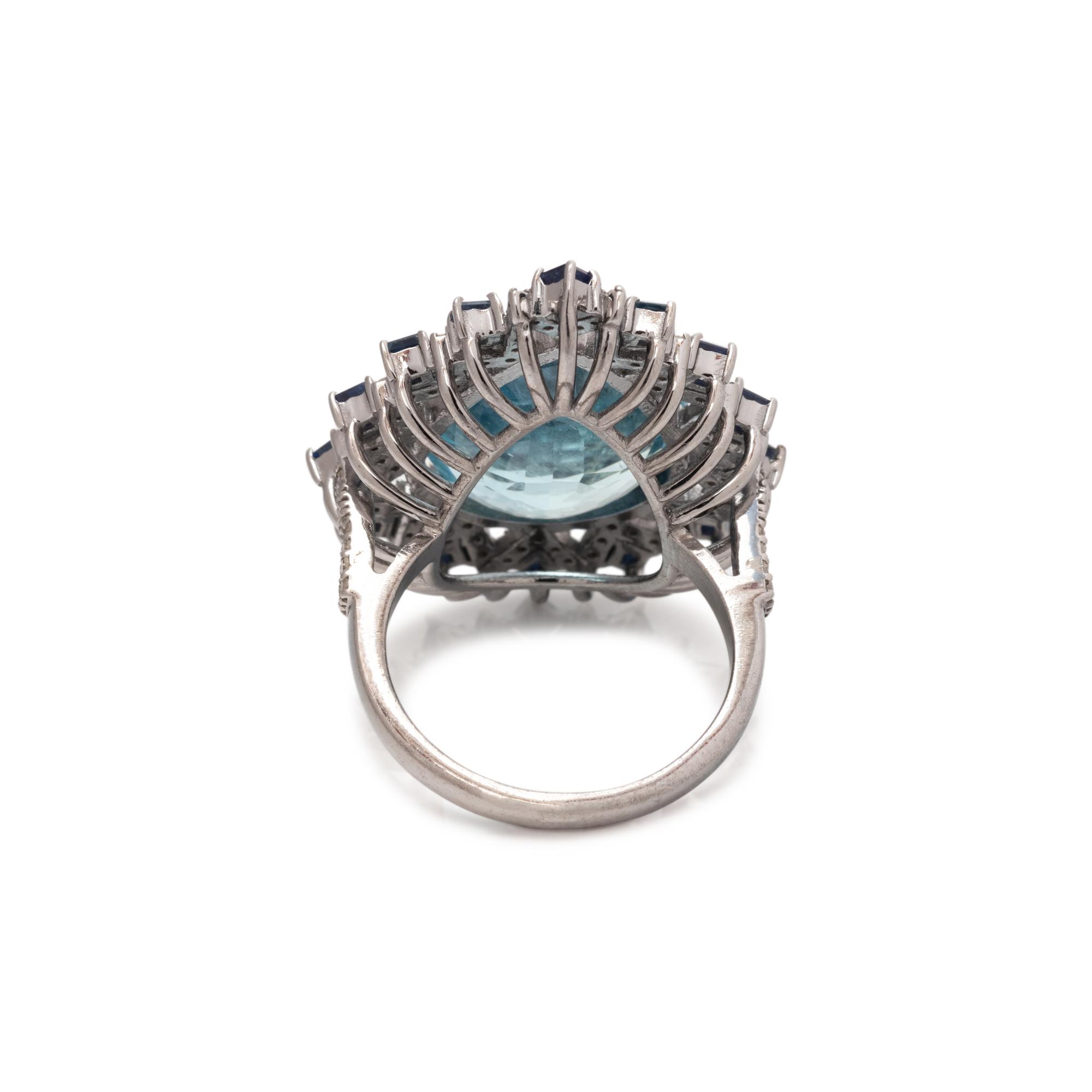 AQUAMARINE, SAPPHIRE AND DIAMOND RING