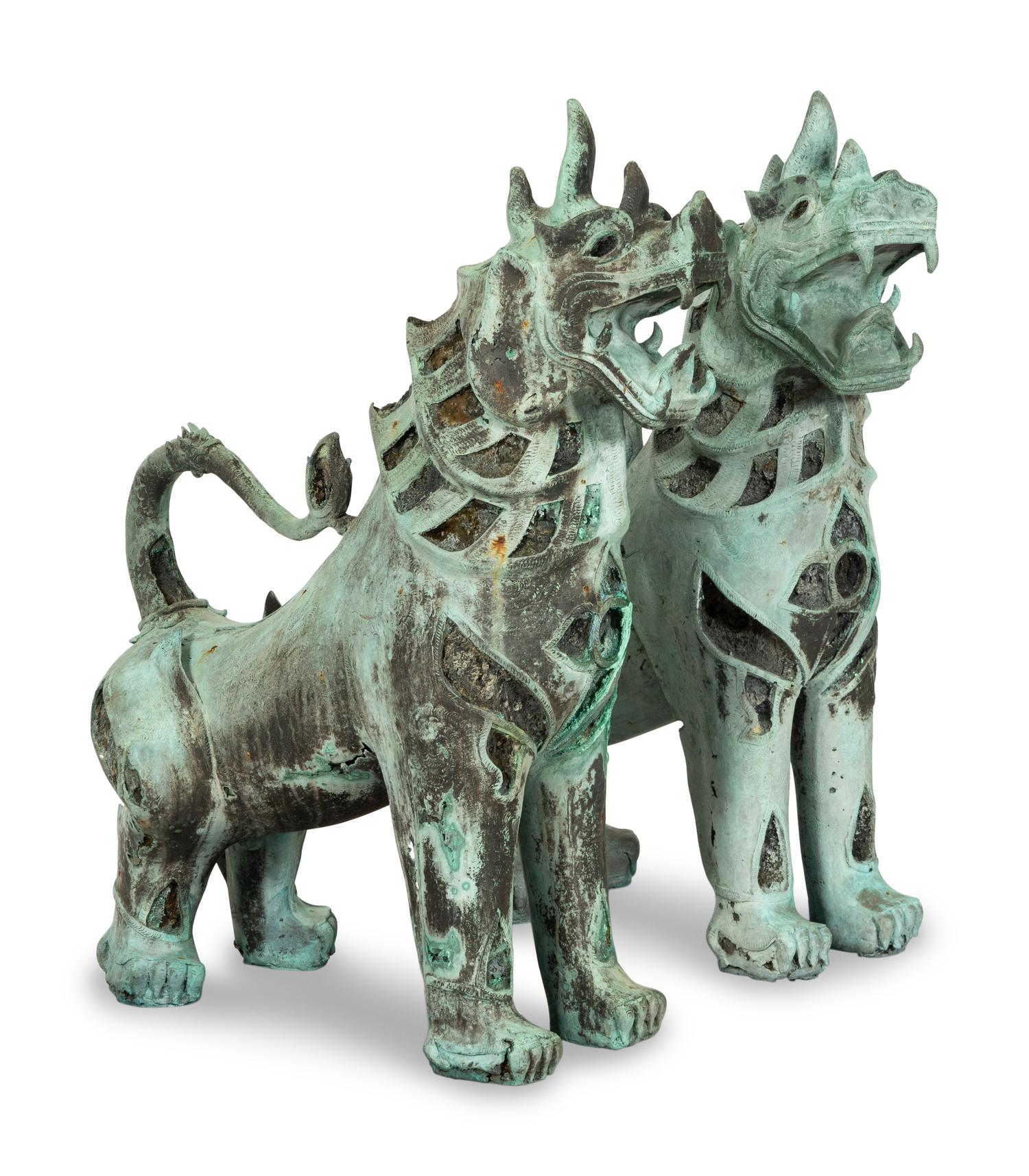 A Pair of Large Patinated Bronze Temple Lions