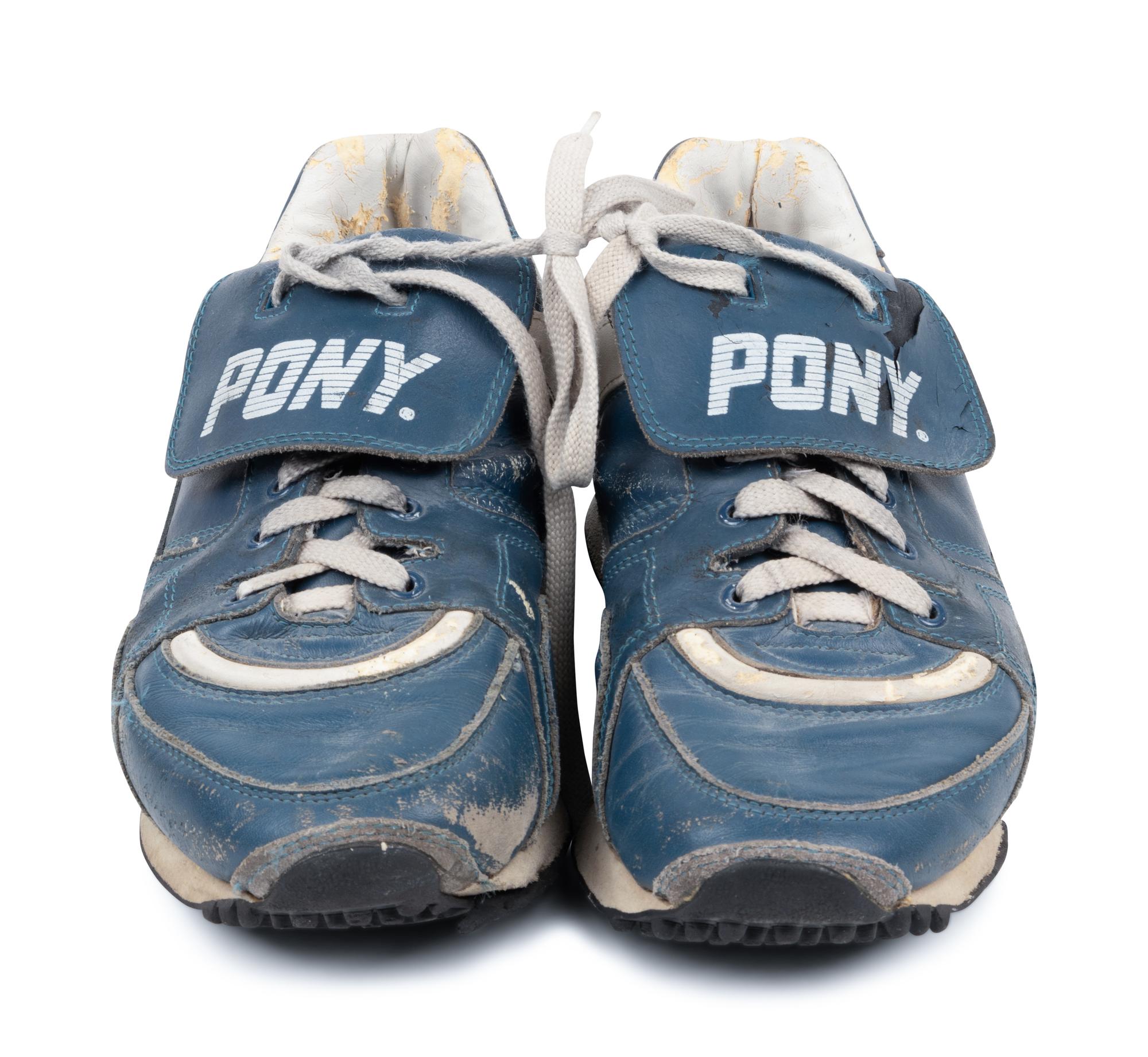 A Pair of Greg Maddux Game Used Pony Cleats,