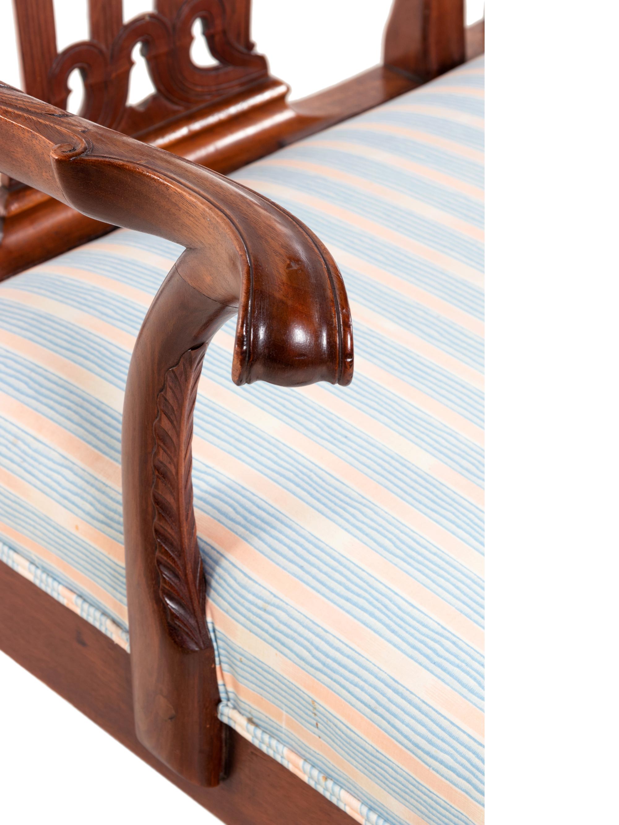 A George III Style Carved Mahogany Triple-Back Settee