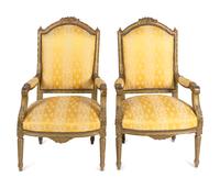 A Pair of Louis XVI Style Carved Giltwood Fauteuils — 20TH CENTURY