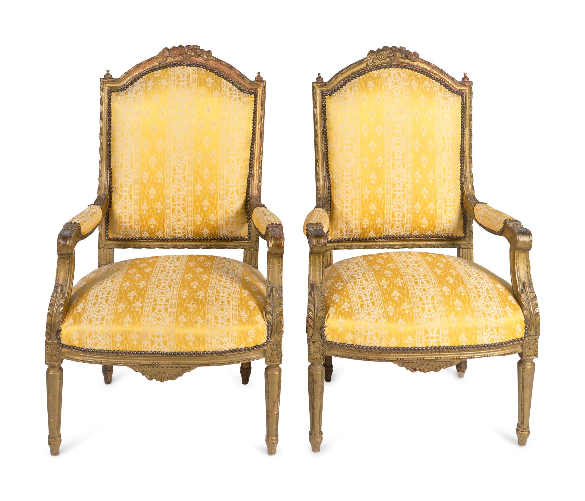 A Pair of Louis XVI Style Carved Giltwood Fauteuils — 20TH CENTURY