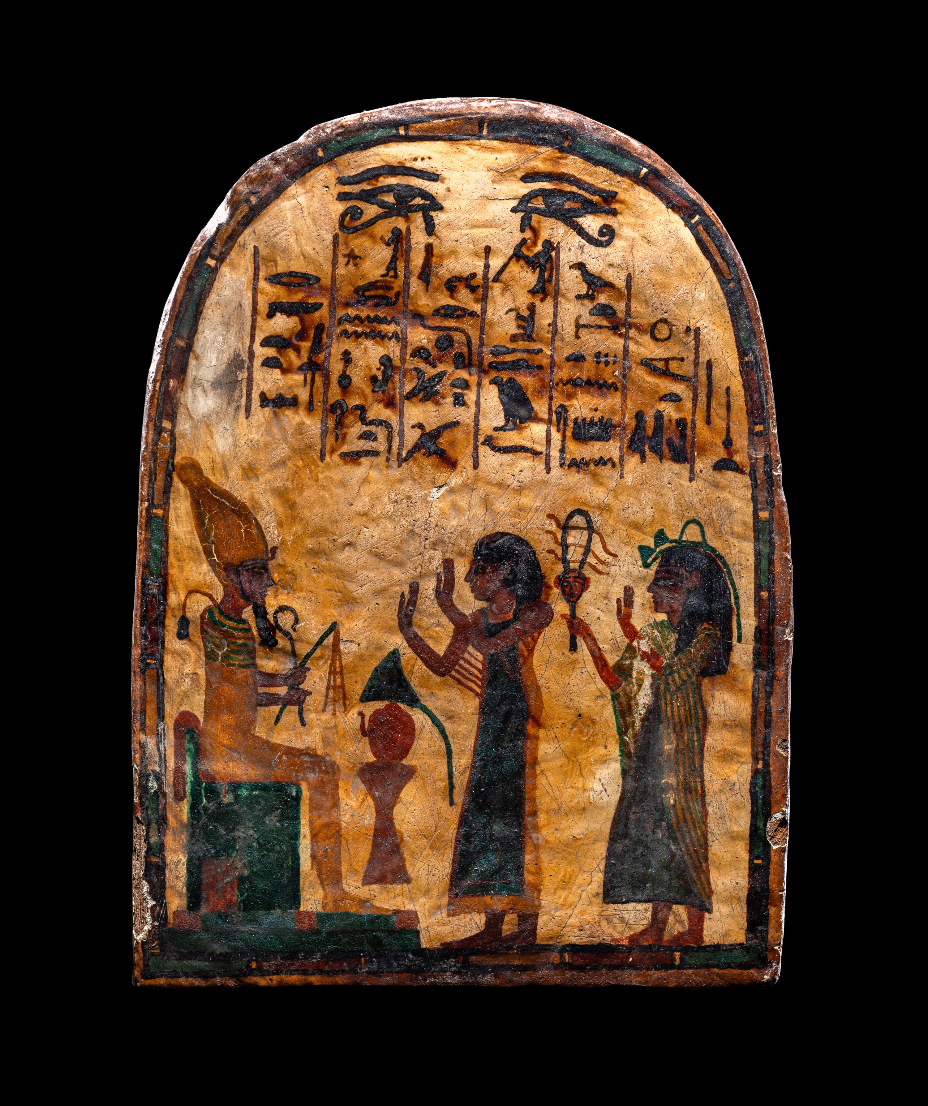 An Egyptian Painted Wood Round-Top Stele