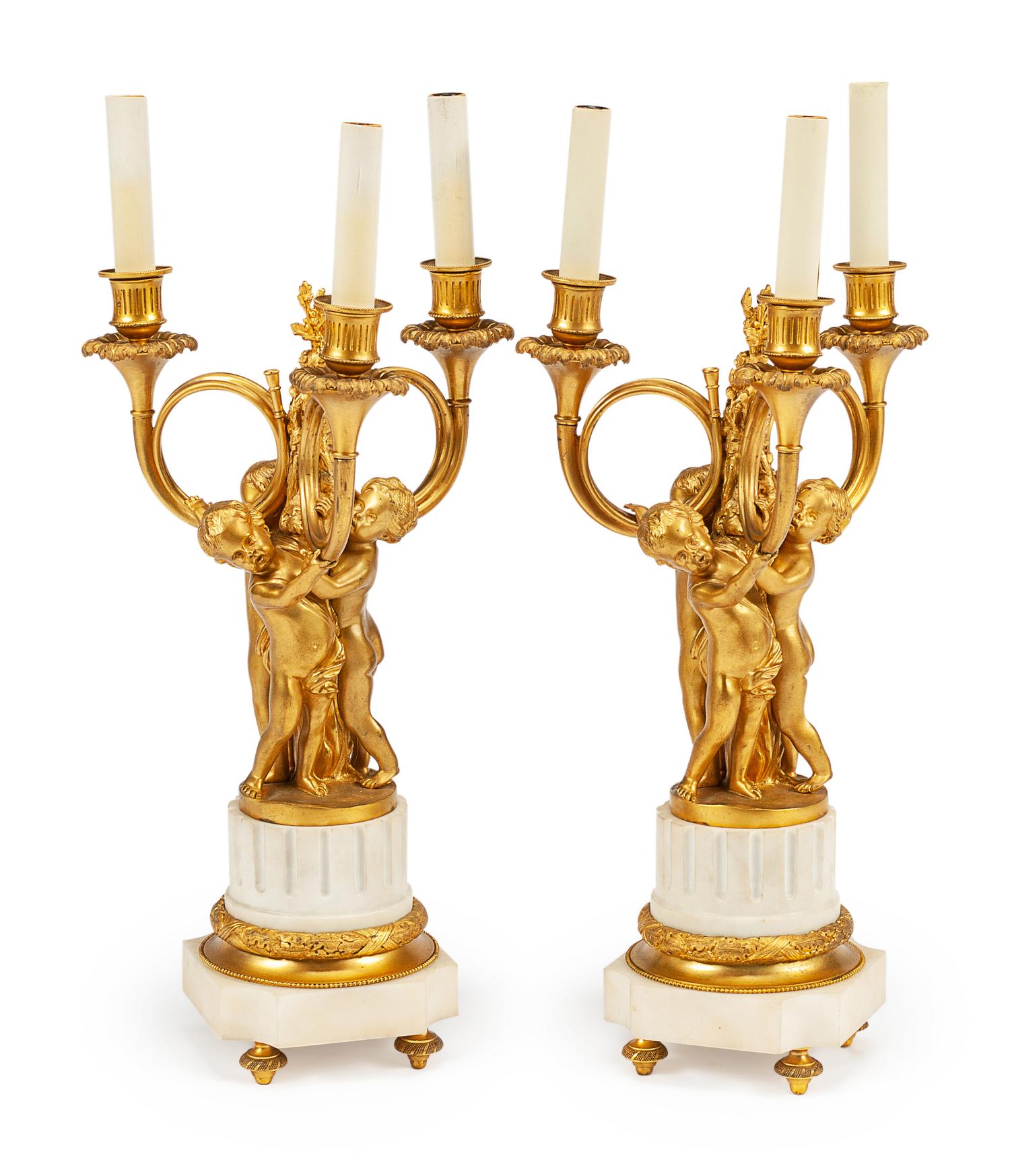 A Pair of Louis XVI Style Gilt Bronze and Marble Three-Light Candelabra
