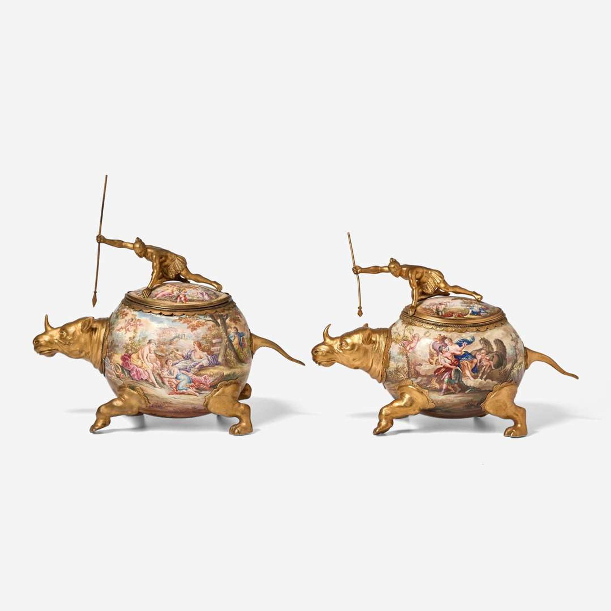 A pair of gilt metal and enamel covered vessels in the form of hunters riding rhinoceros Probably Vienna, Austria, late 19th century