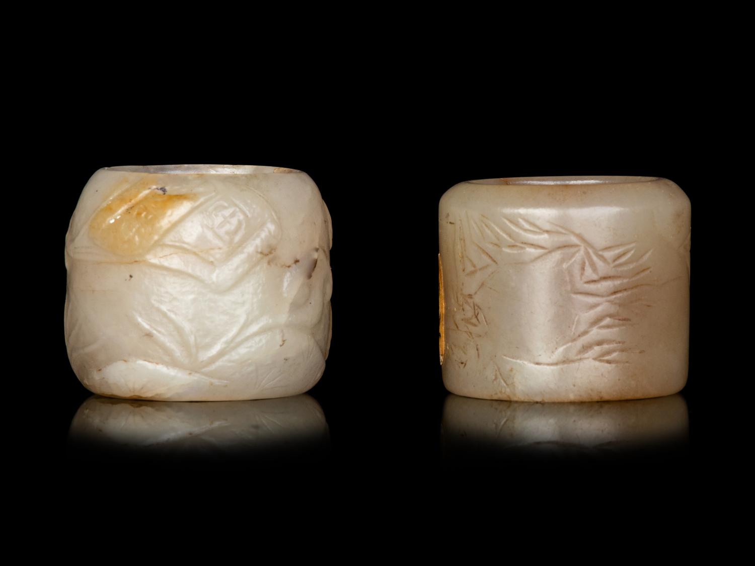 Two Carved Celadon Jade Archer's Rings