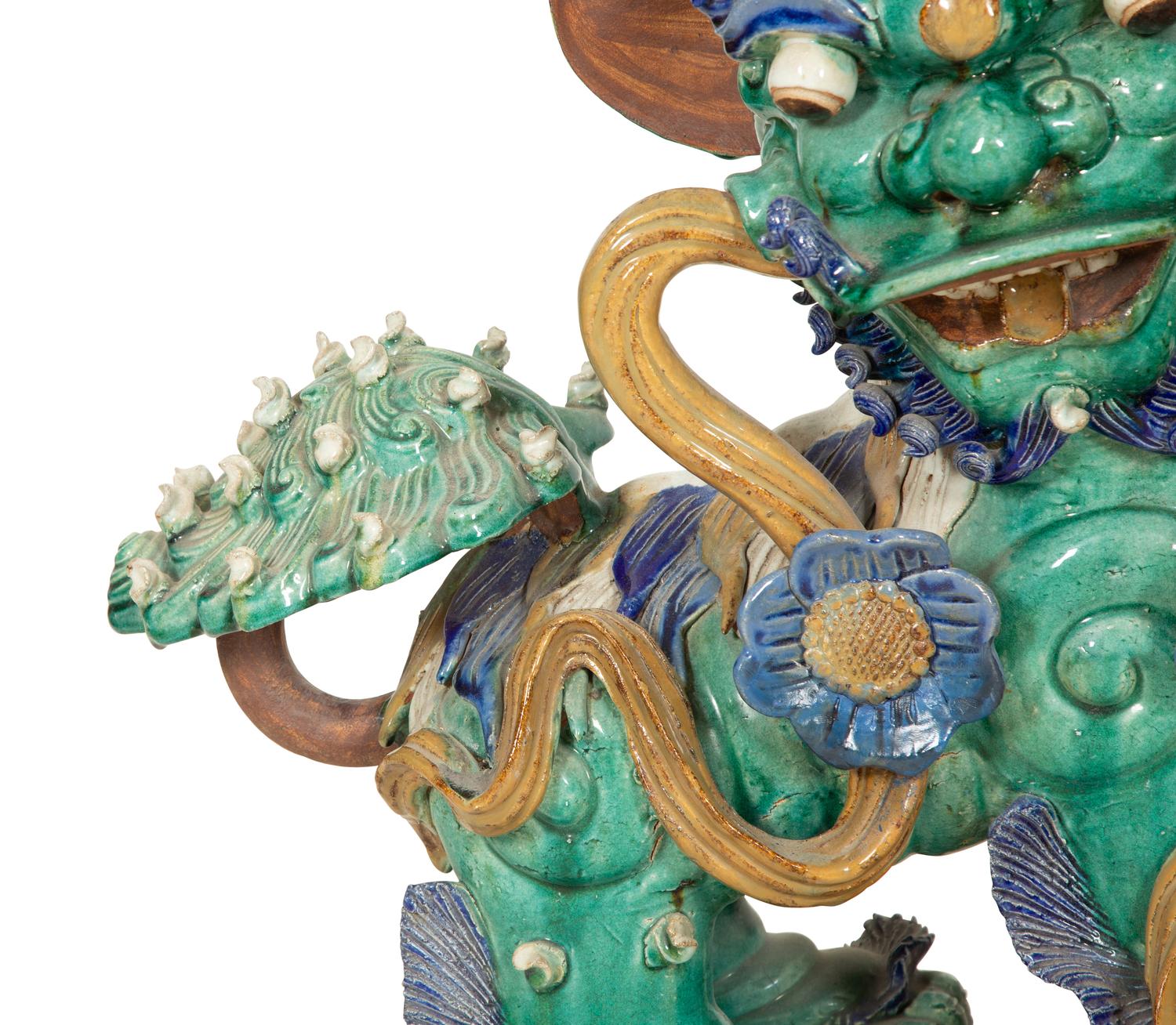 A Pair of Chinese Glazed Ceramic Foo Dogs