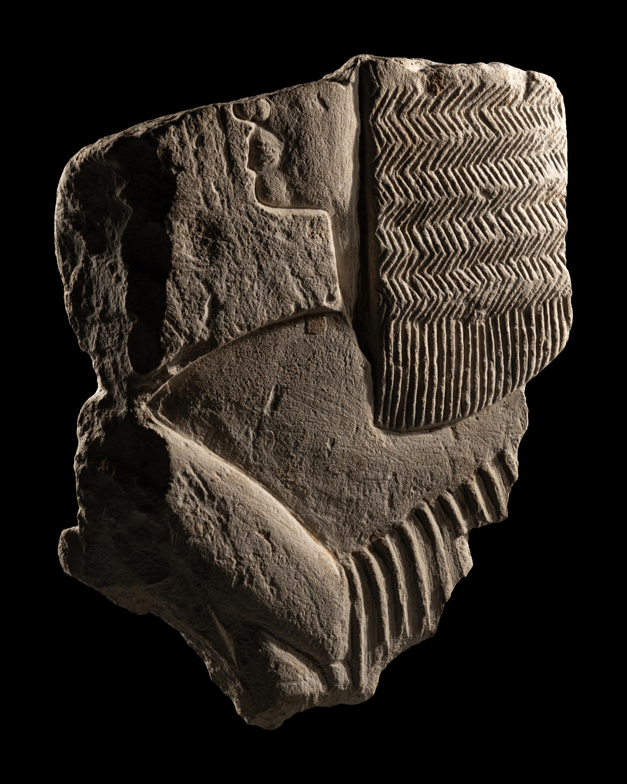 An Egyptian Limestone Relief Fragment