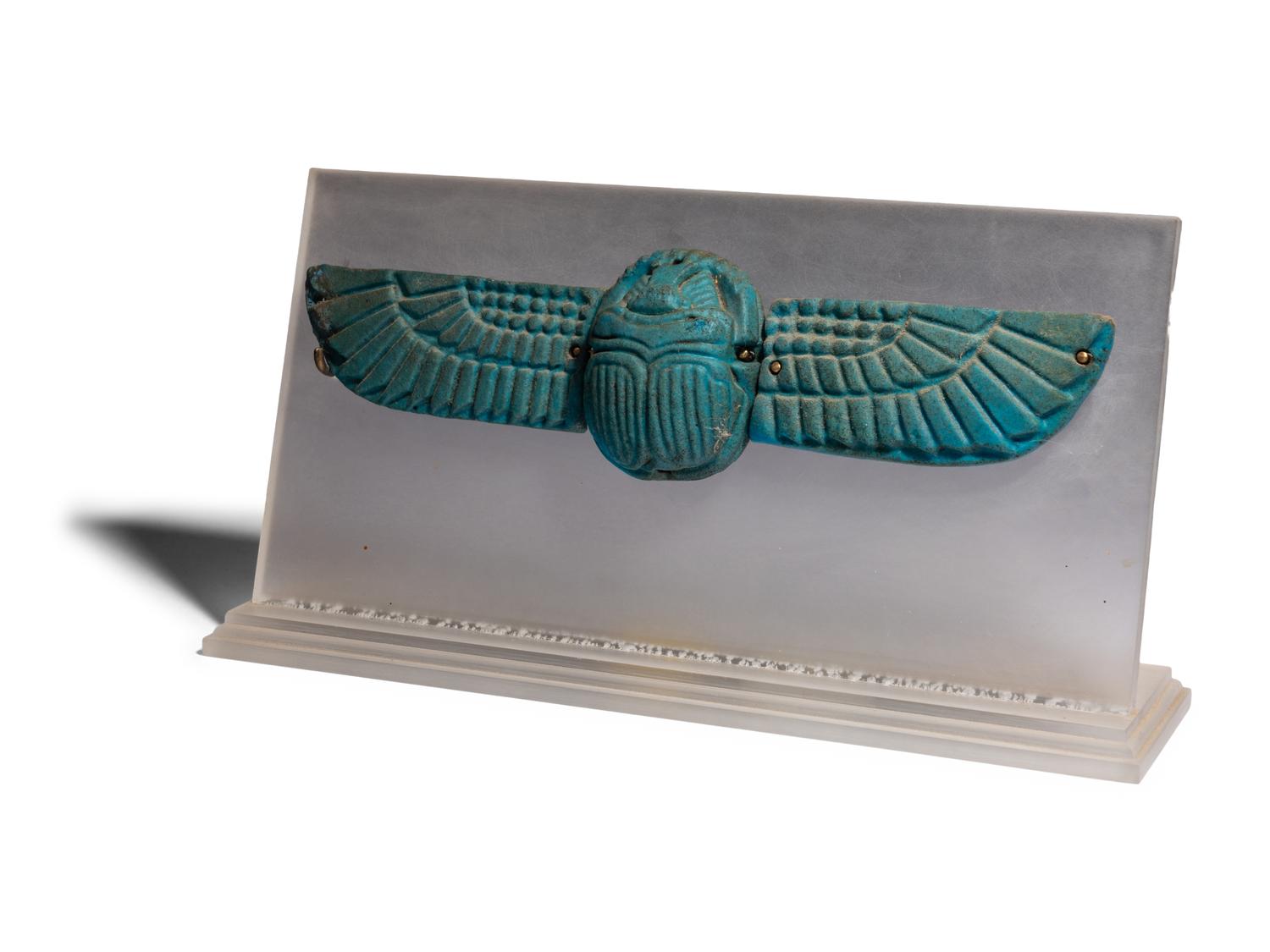 An Egyptian Faience Winged Scarab