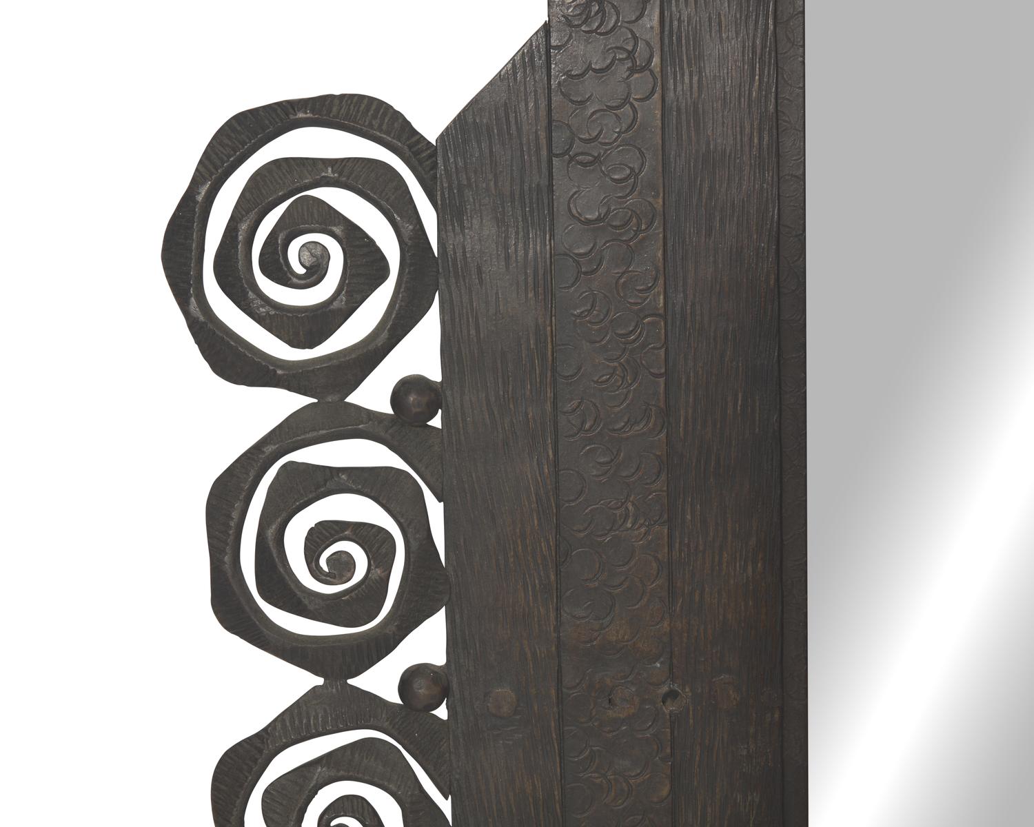 A French Art Deco wrought iron mirror, signed "Denand," circa 1930