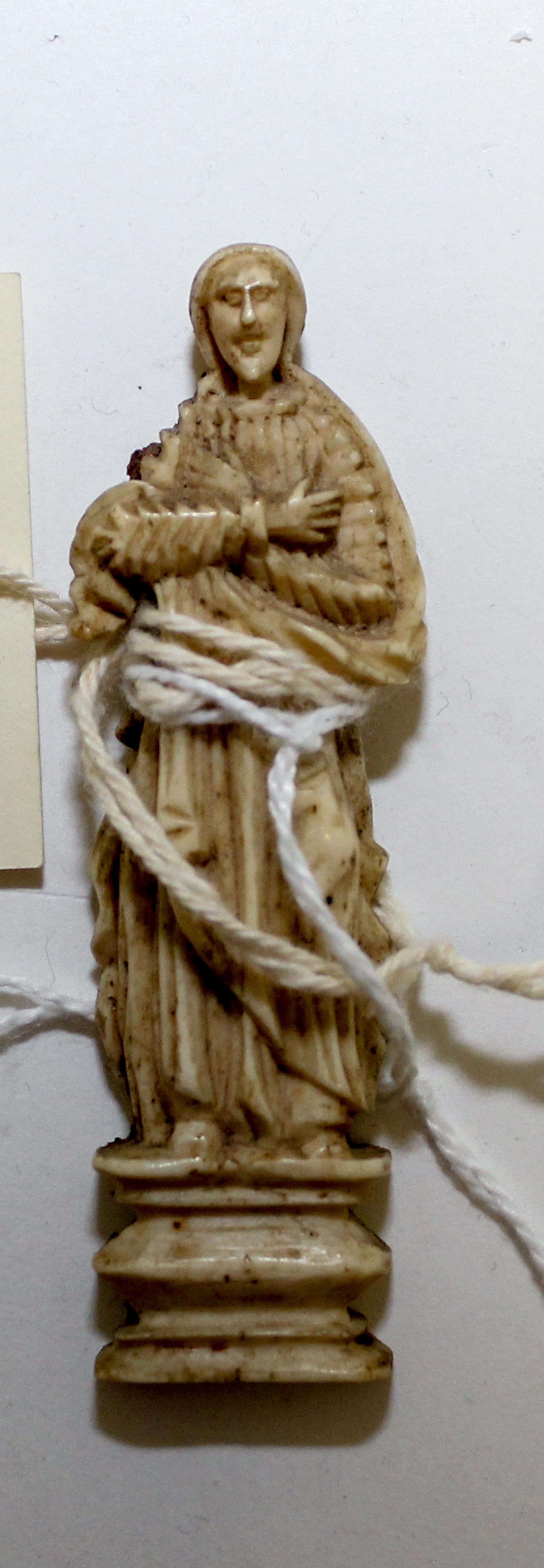 A Small Spanish Colonial Carved Resin Figure of a Saint Height 2 3/4 inches. — 18TH CENTURY