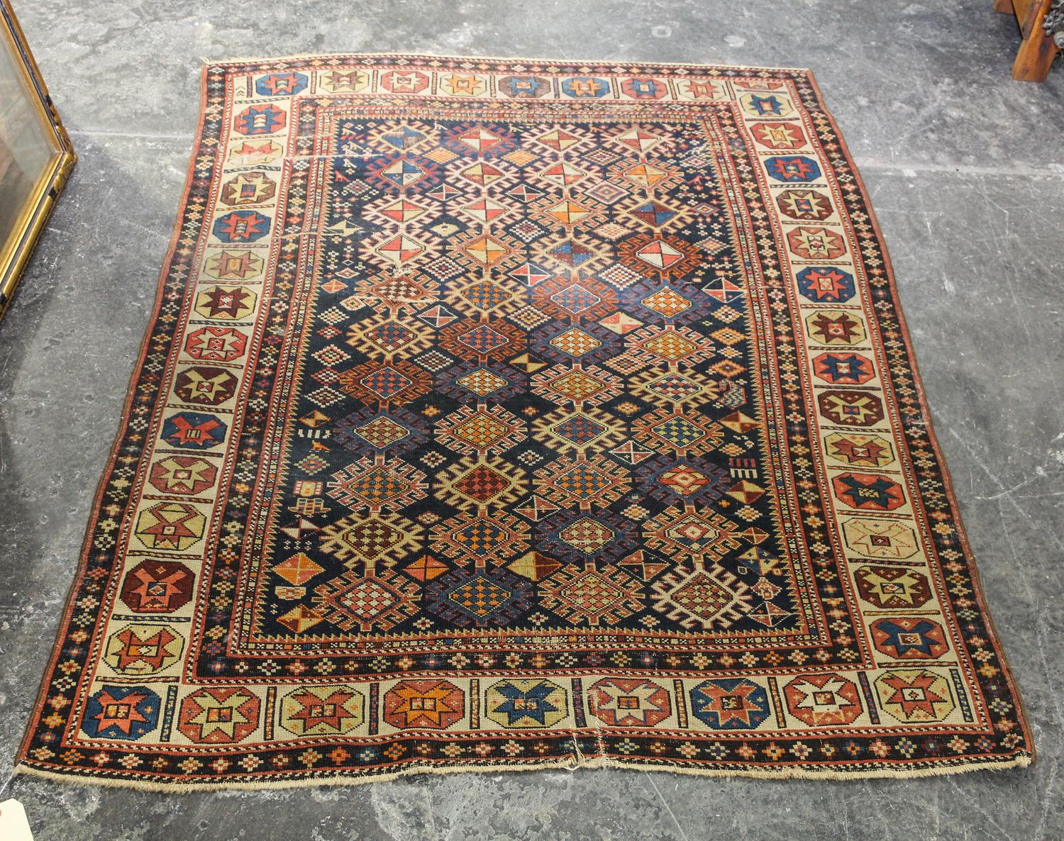 A Caucasian Kuba Wool Rug 4 feet 11 1/2 inches x 3 feet 11 1/2 inches.