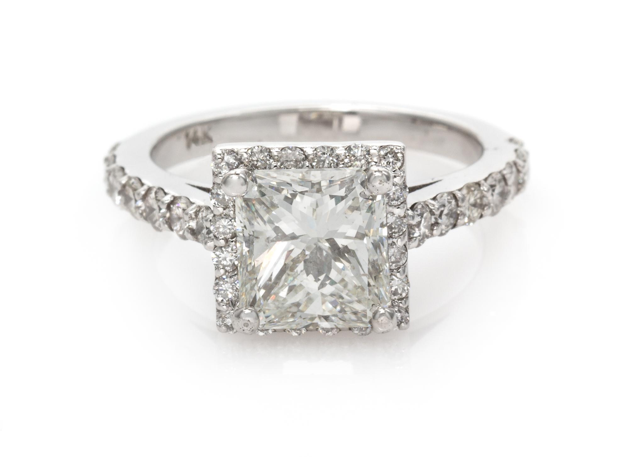 A 14 Karat White Gold and Diamond Ring, 3.35 dwts.