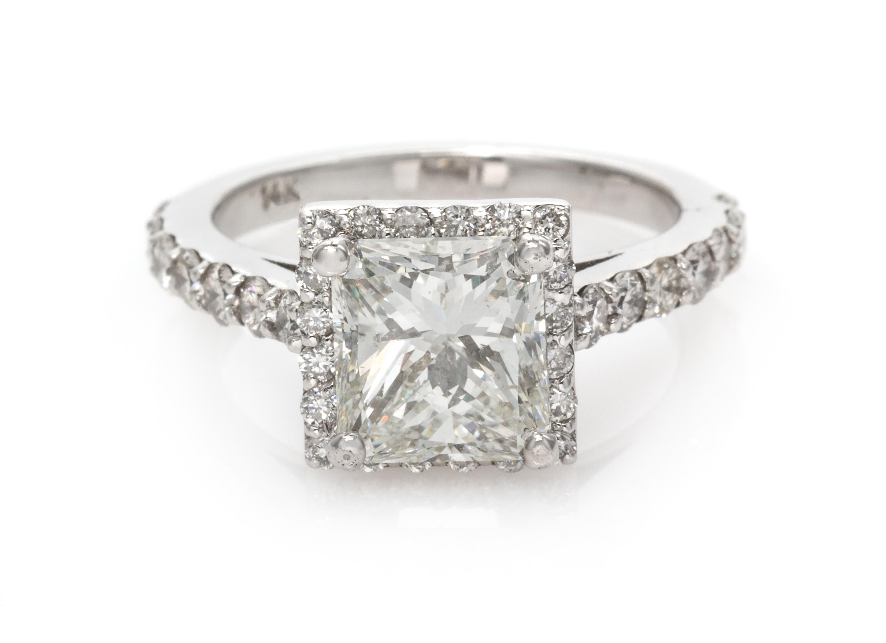 A 14 Karat White Gold and Diamond Ring, 3.35 dwts.