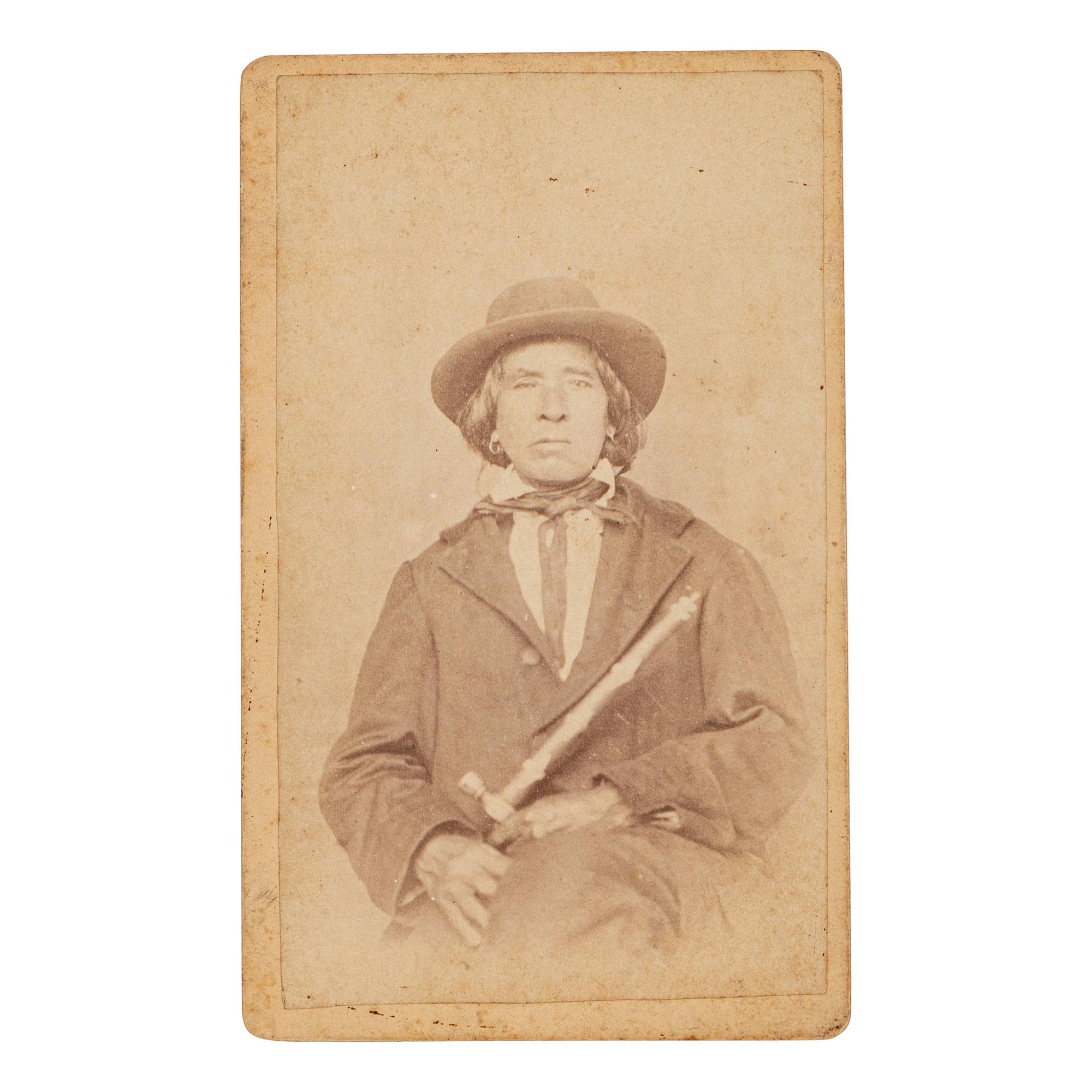 [NATIVE AMERICANS]. CDV of Native American identified as Osage Chief John Red Corn with treaty tomahawk. N.p.: n.p., 1889.