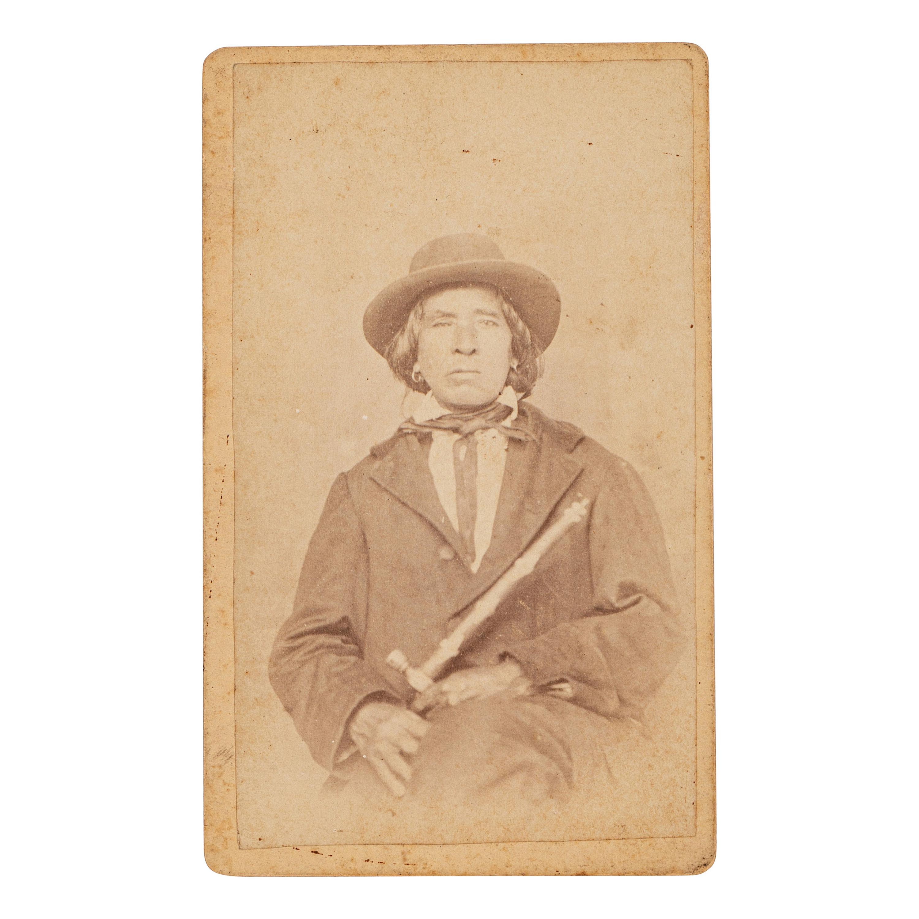 [NATIVE AMERICANS]. CDV of Native American identified as Osage Chief John Red Corn with treaty tomahawk. N.p.: n.p., 1889.