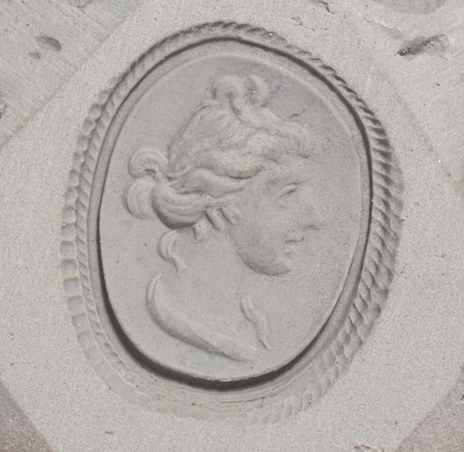 A Roman Banded Agate Intaglio with the God Apollo — Set in a gold brooch with rams