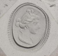 A Roman Banded Agate Intaglio with the God Apollo — Set in a gold brooch with rams