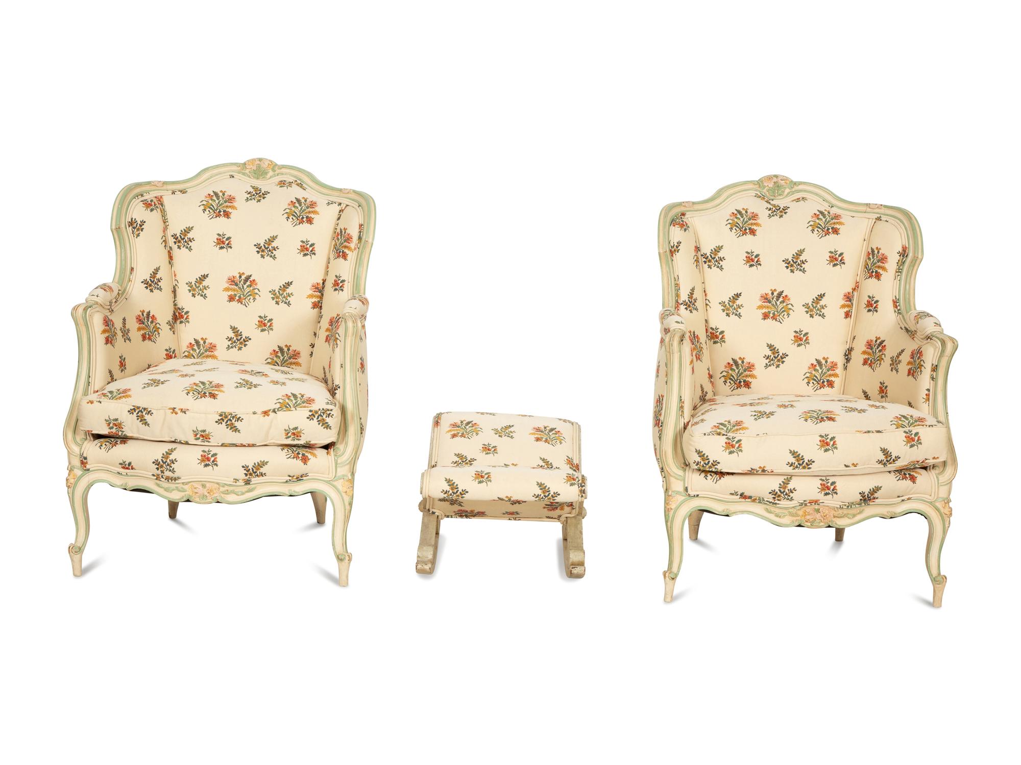 A Pair of Louis XV Style Painted Wingback Bergères and an Associated Stool