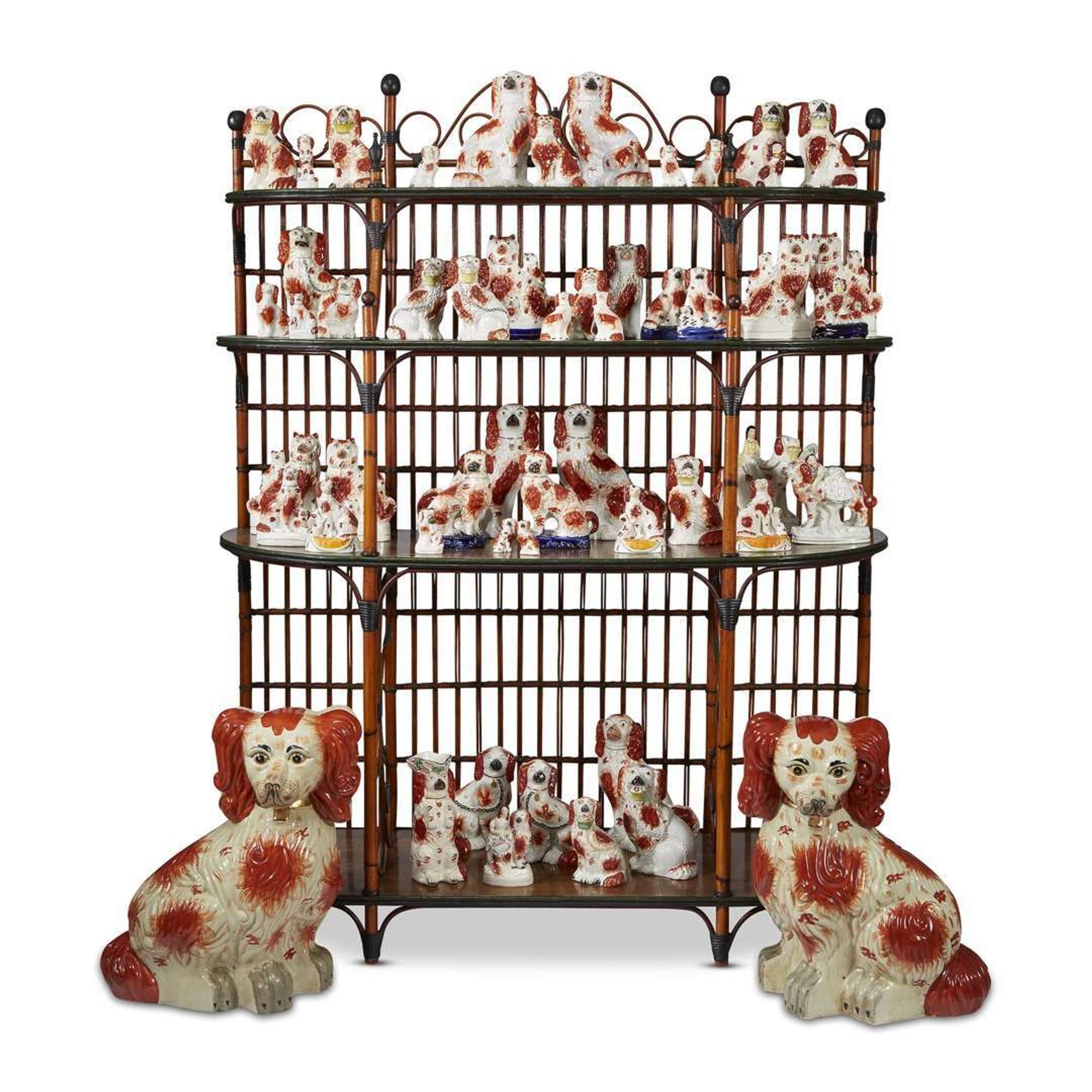 A large collection of seated Staffordshire dog figures 19th/20th centuries