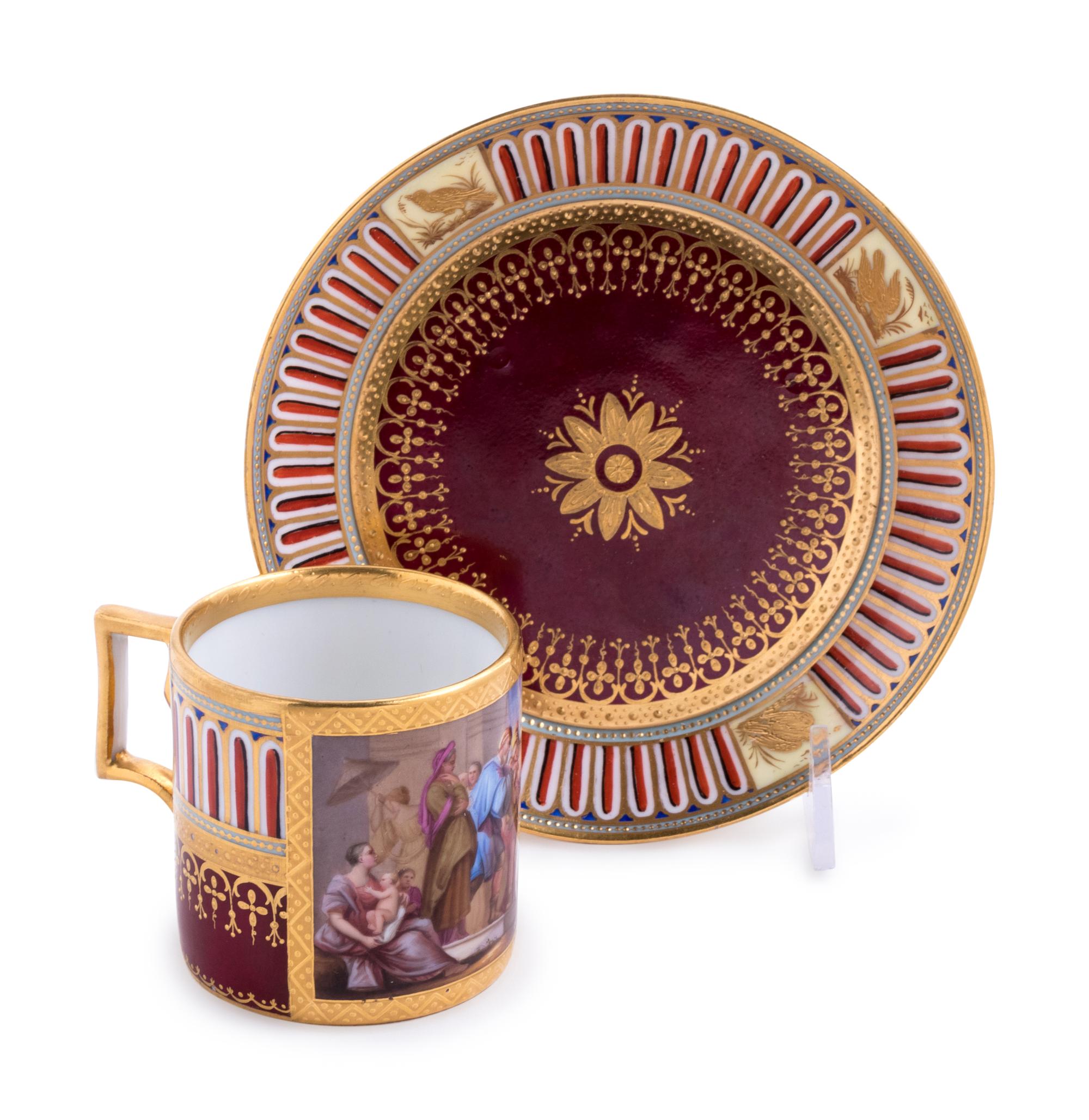 A Vienna Painted and Parcel Gilt Porcelain Teacup and Saucer